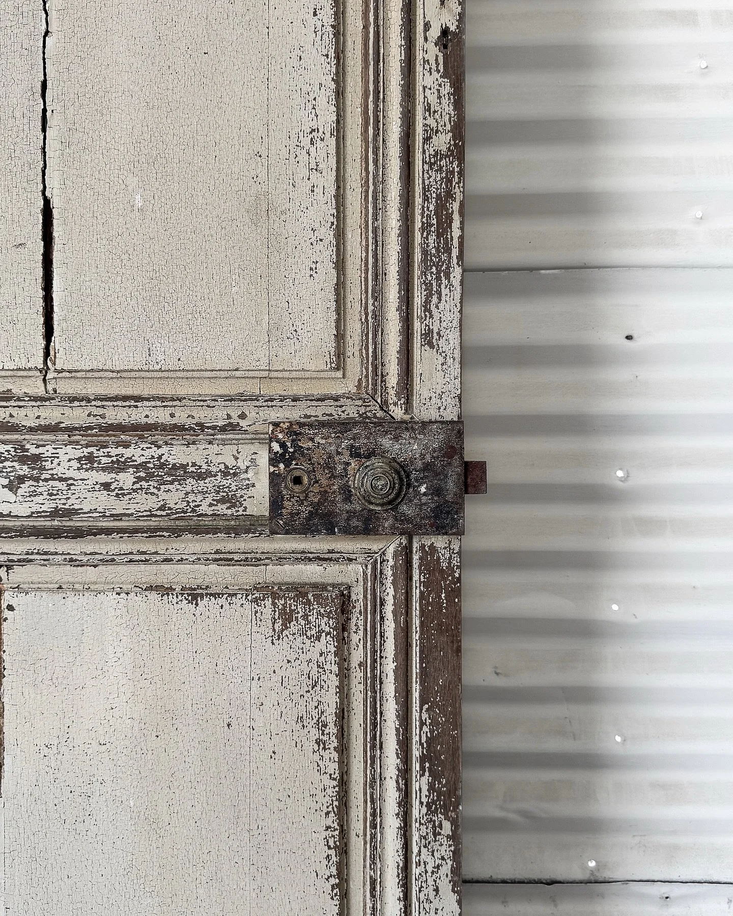 [Available] Layers of paint, years of use, and a lifetime of stories.

This late 1800s French door is all texture, tone, and timeworn soul. Cream on one side, sage-grey on the other&mdash;aged to perfection.

Approximately 29.625&rdquo; W x 80.625&rd