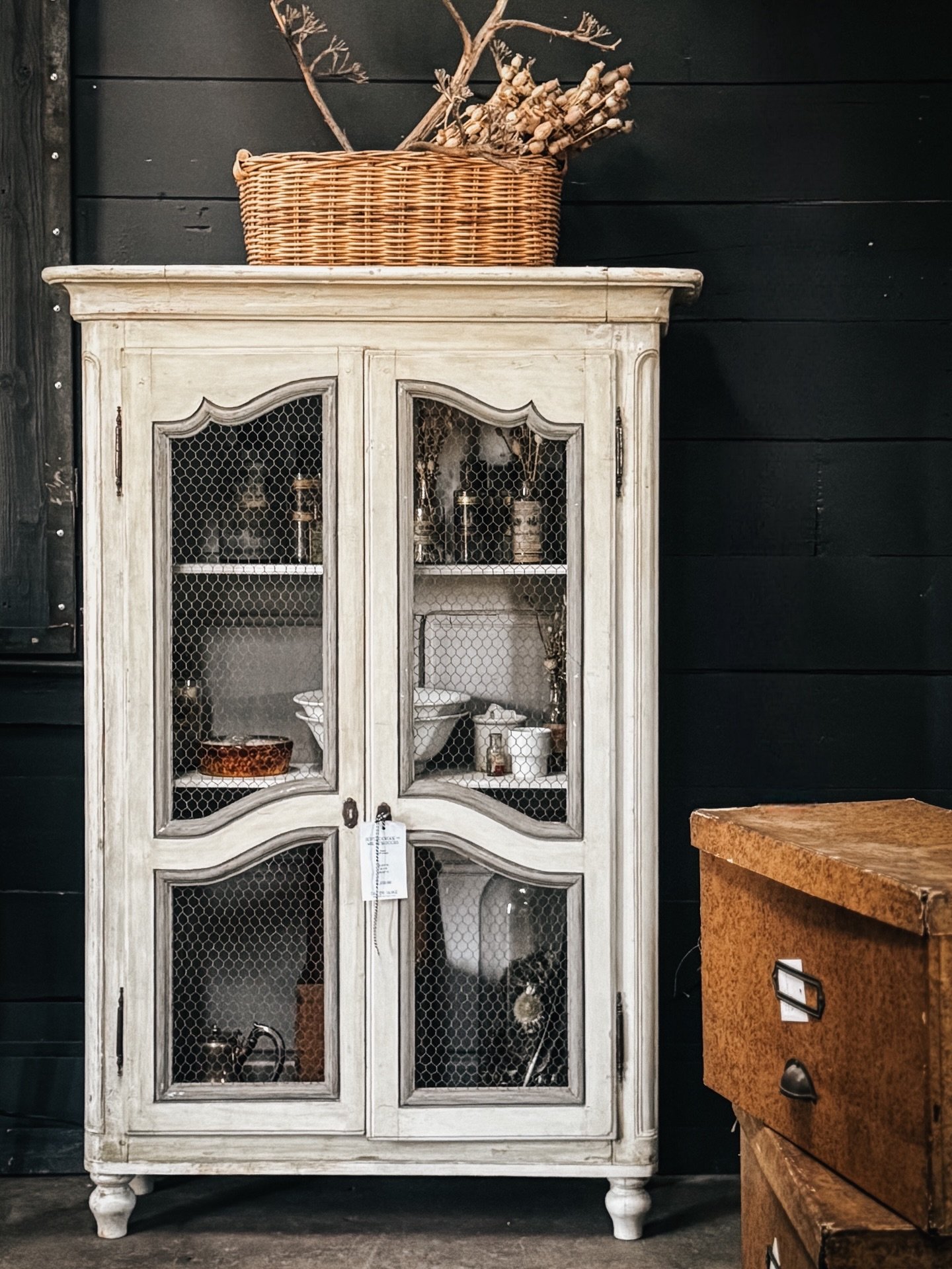 A look inside our historic barn, showcasing the last remaining treasures from this year&rsquo;s collection.

A pair of French petite bookcases with wire mesh doors, transformed into curiosity cabinets filled with 19th-century apothecary bottles sourc