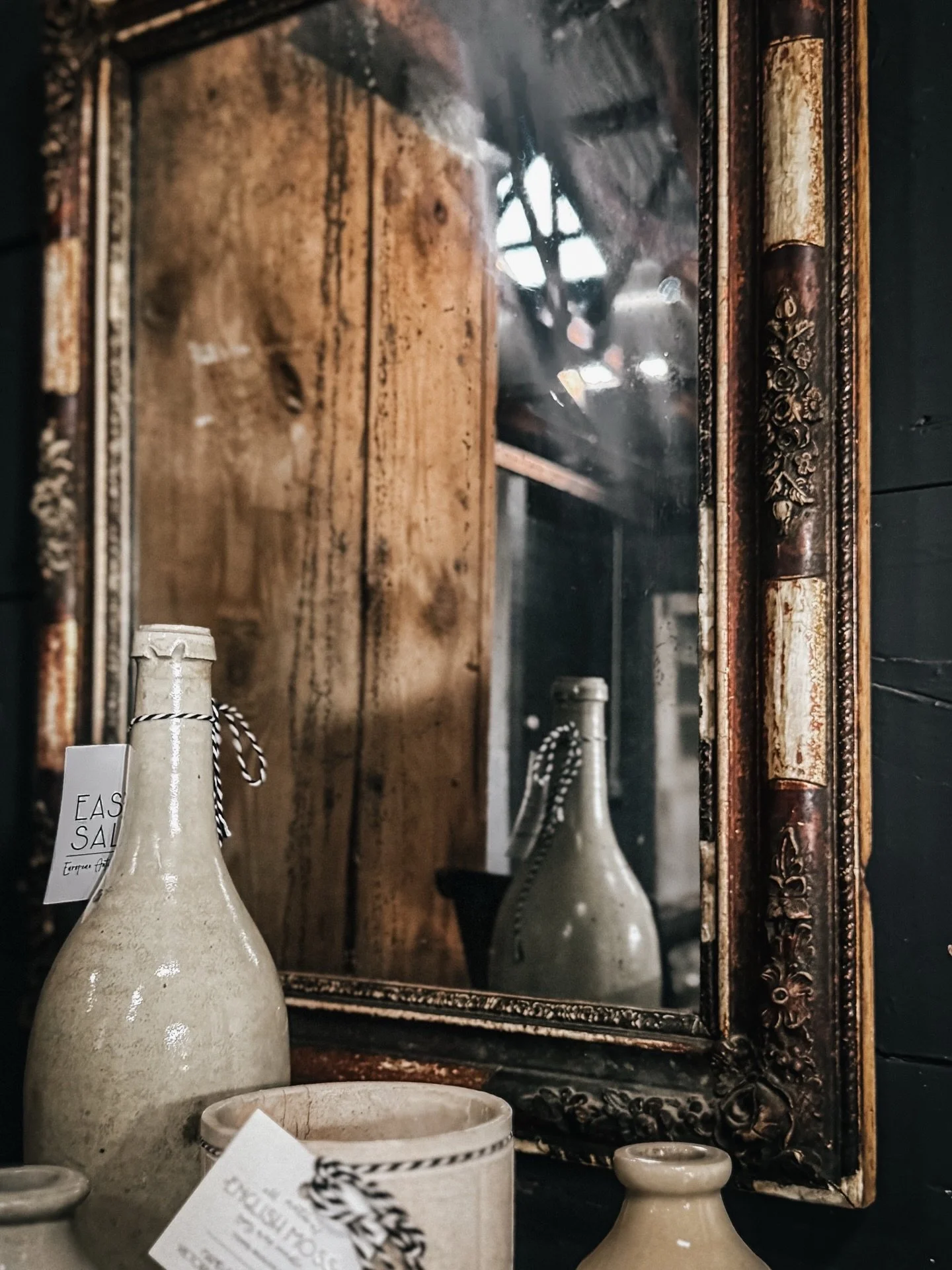 A look inside our historic barn, showcasing the last remaining treasures from this year&rsquo;s collection.

An antique French mirror reflects stoneware pottery, while Swedish corner cupboards adorned with reeded details and layers of dry-scraped pai