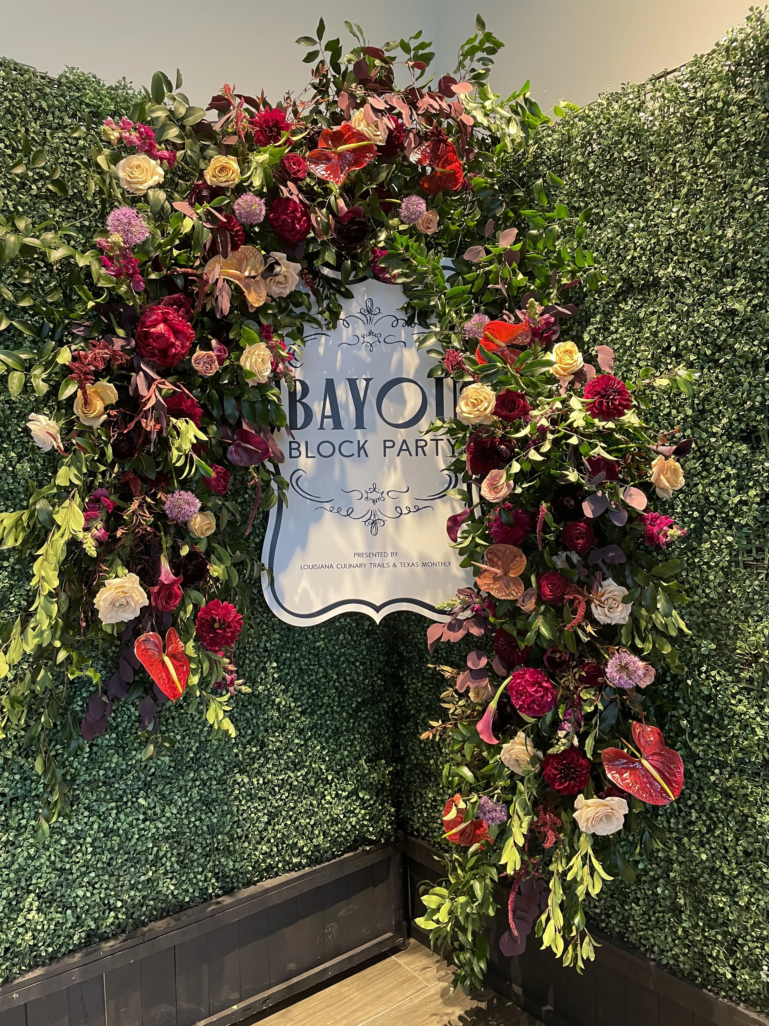 Entrance to corporate event in Houston with florals