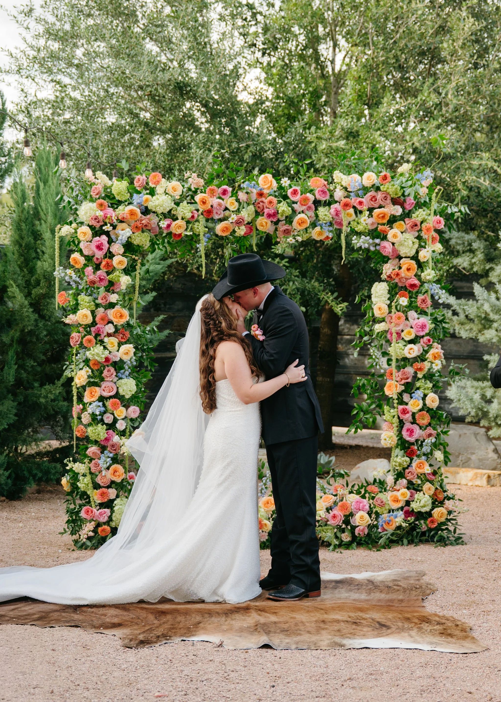 A lush square floral arch created by the best Central Texas wedding florist in the area