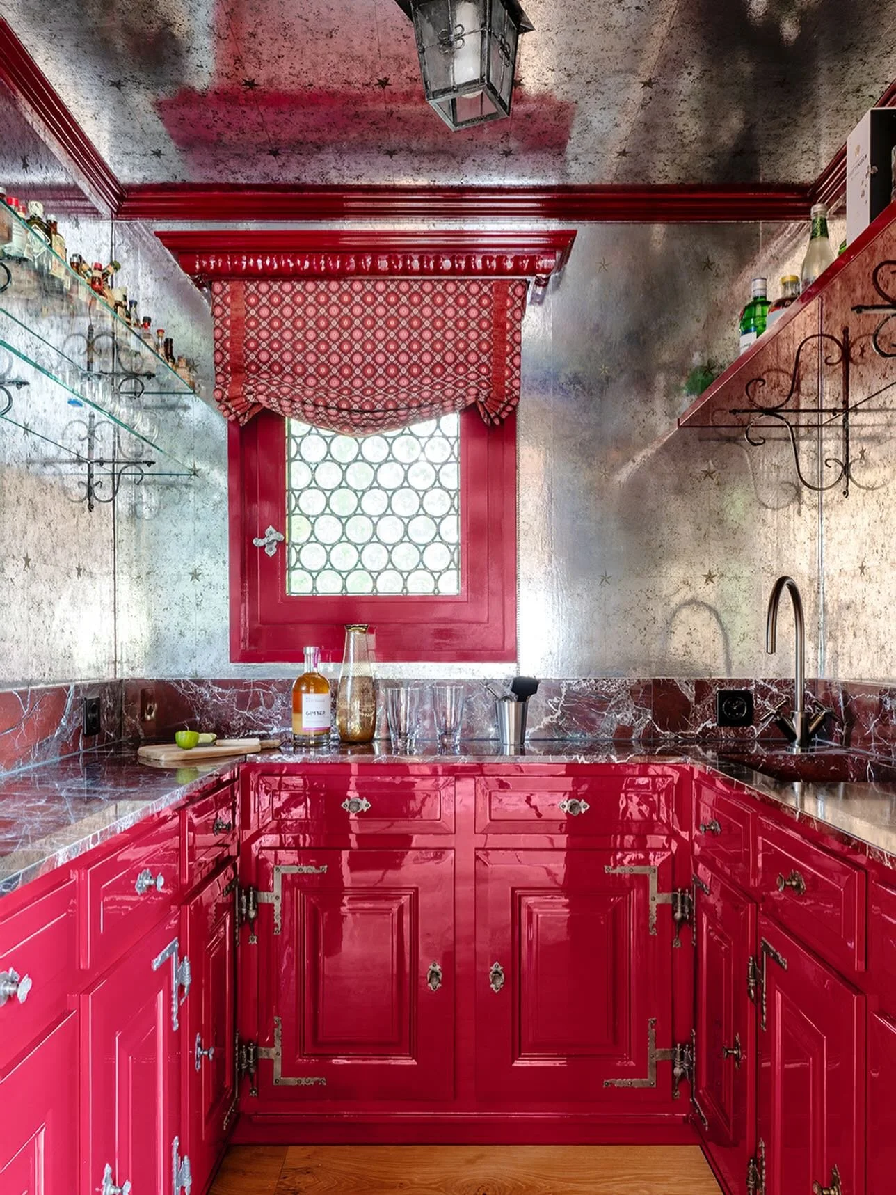 In love ❤️ with this little bar my studio designed for a Chalet renovation in Switzerland. The bar joinery existed already when the client bought the Chalet. We had it lacquered, kept the original handles, used a mirrored wallpaper from @schumacher_u