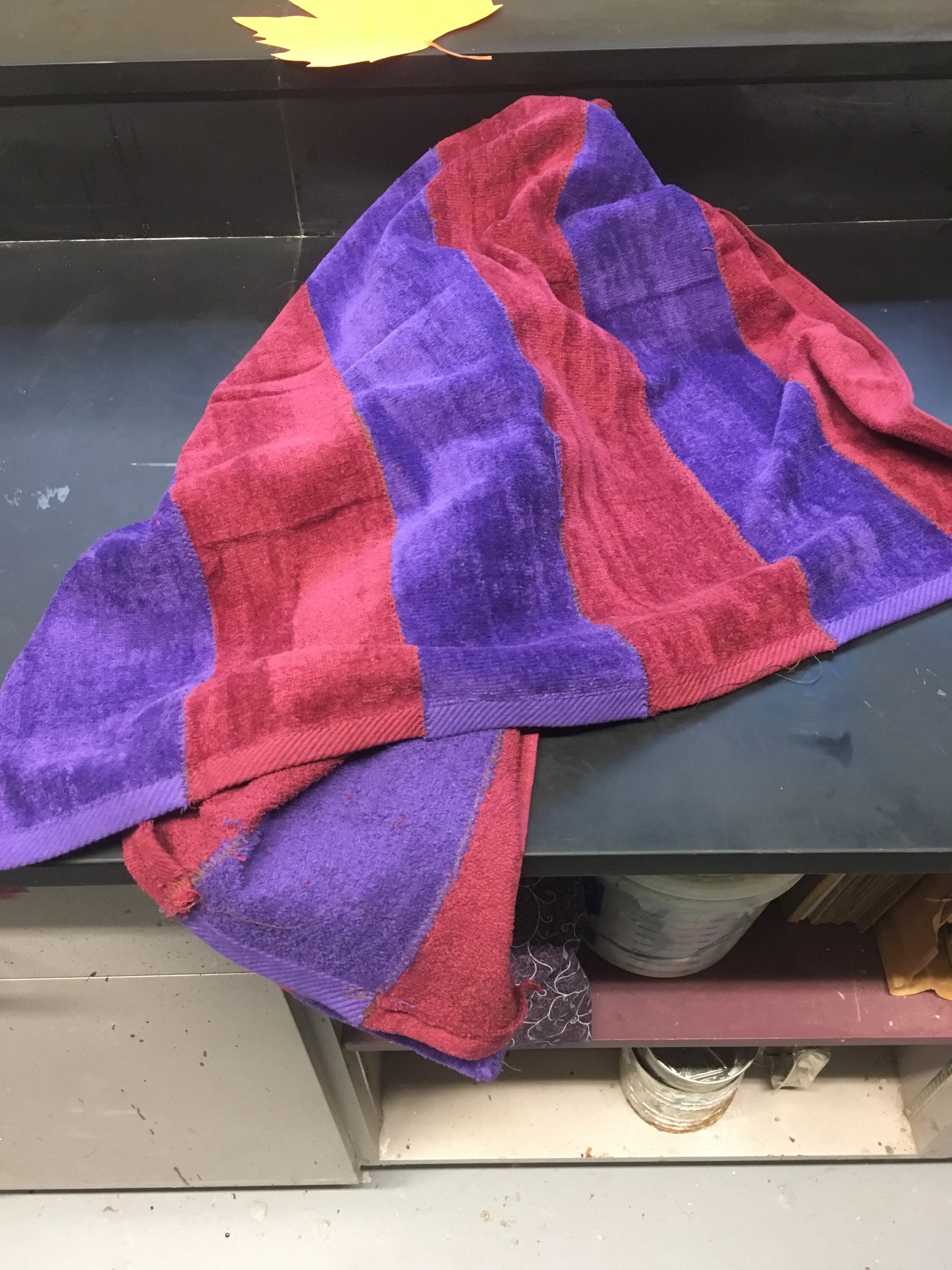 The Script's "Red and Purple Towel" didn't exist on the internet to purchase, so this a red towel and a purple towel cut into strips and sewn