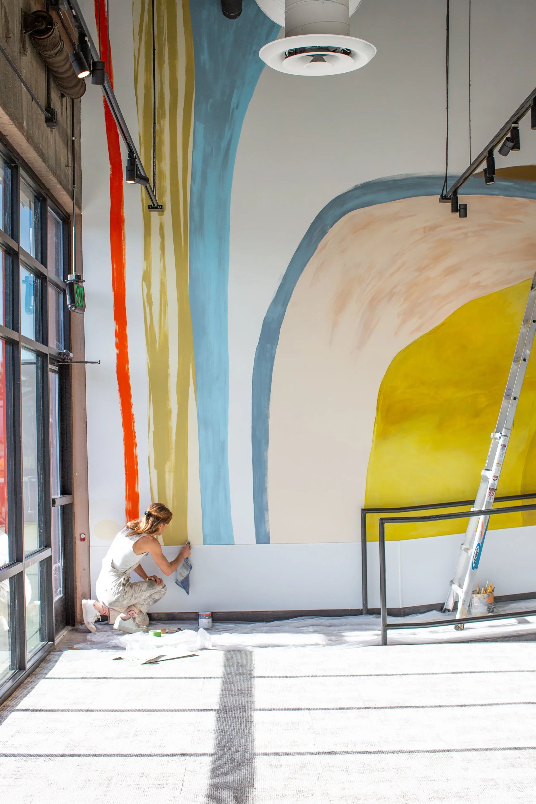 Large-scale abstract mural installation at Modern Market office by Magik Studios in Denver, Colorado