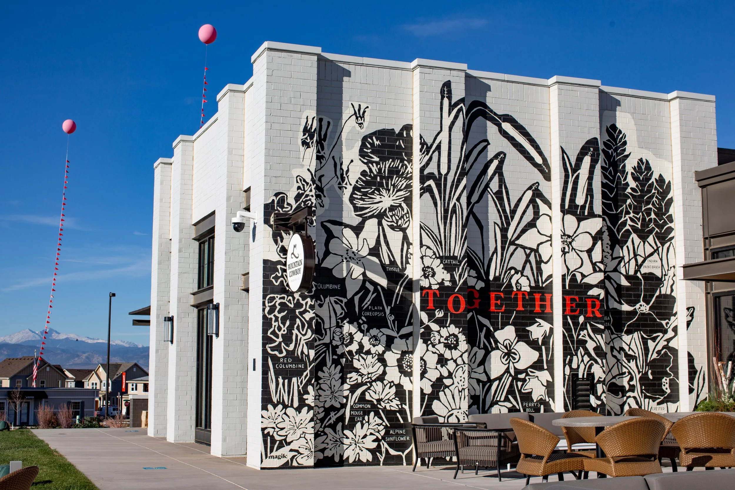 Large-scale wildflower mural at Kinston Centerra Hub by Magik Studios in Loveland, Colorado