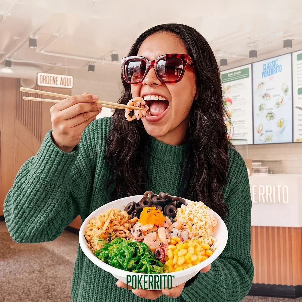 A guest enjoying a Pokerrito poke bowl