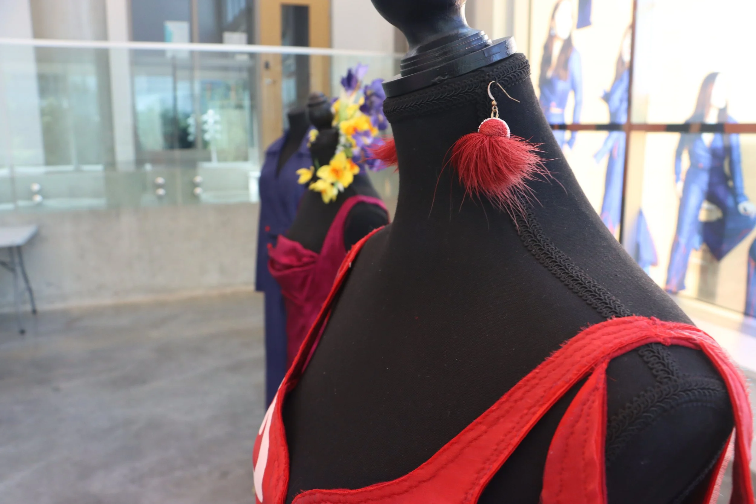 Red reindeer tufted earrings, grad show installation. 2024. 