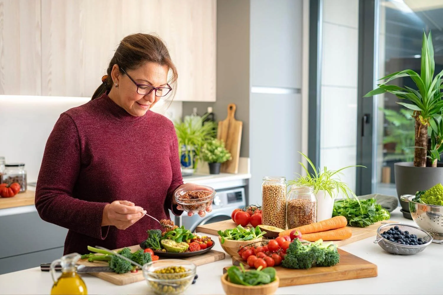 Adult woman preparing a healthy whole-food meal to support strength and healthy aging