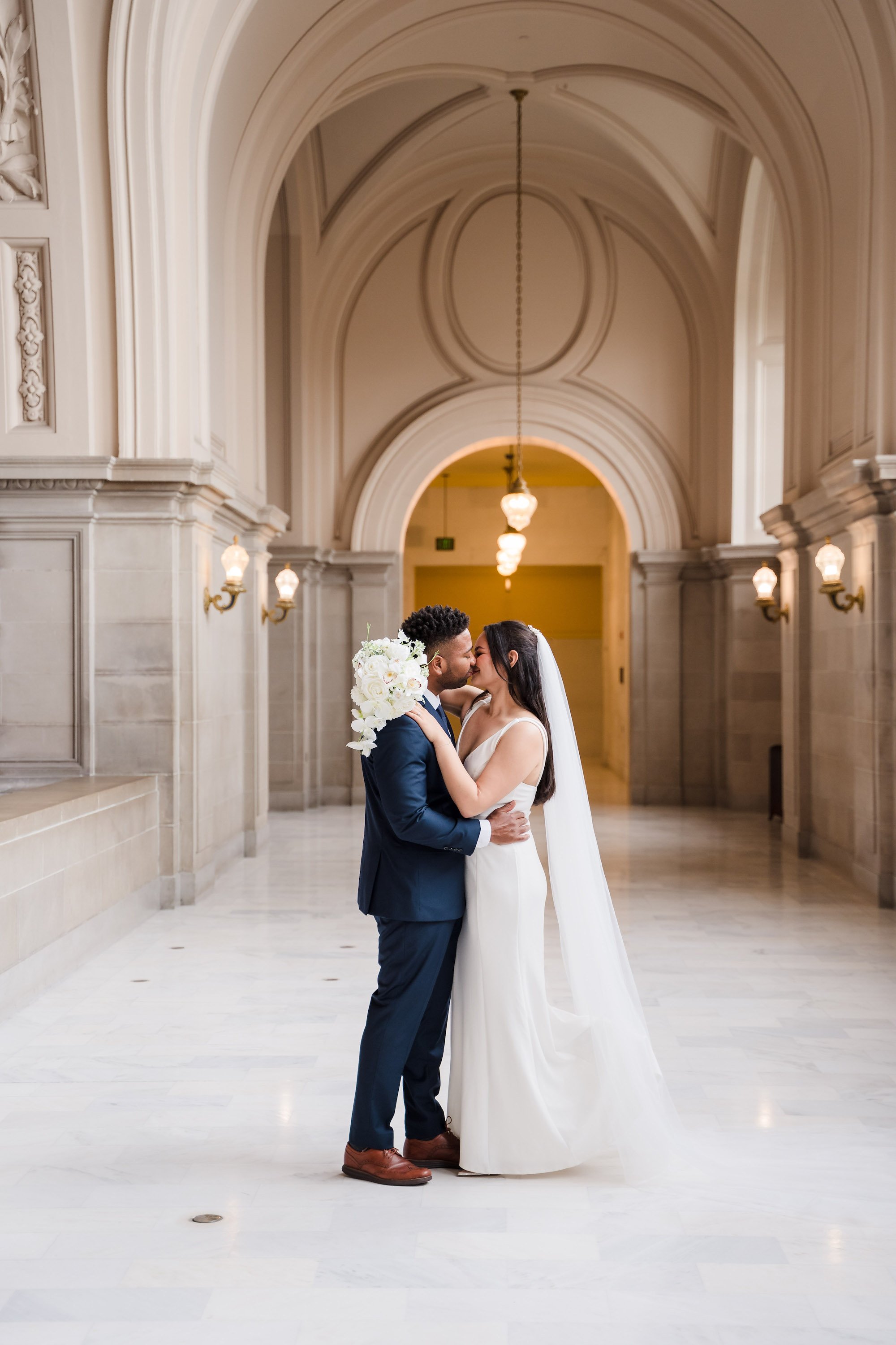 Kissing San Francisco City Hall Wedding.jpg