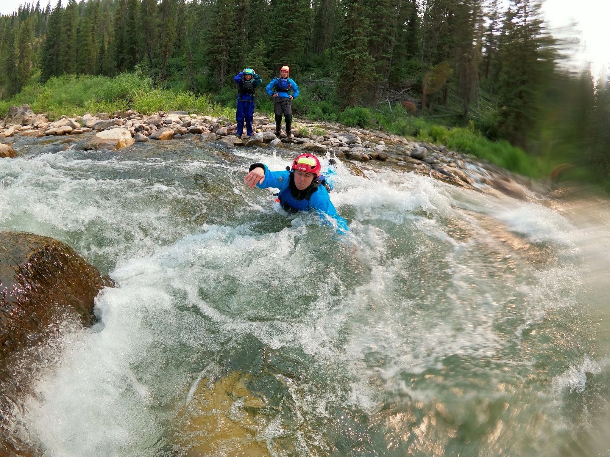 Swimmer Jumps into River during a swiftwater course