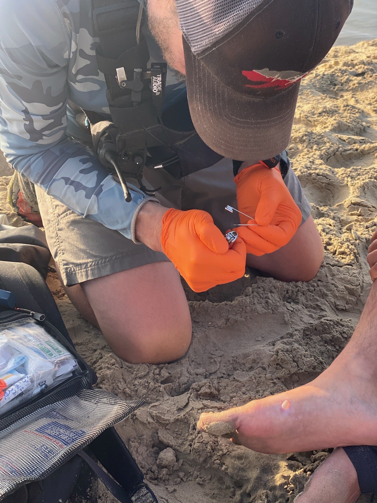 A Wounded Bear Medicine Medic Provides Care To A Televison Show Participant While Working In The Field In Baja Mexico