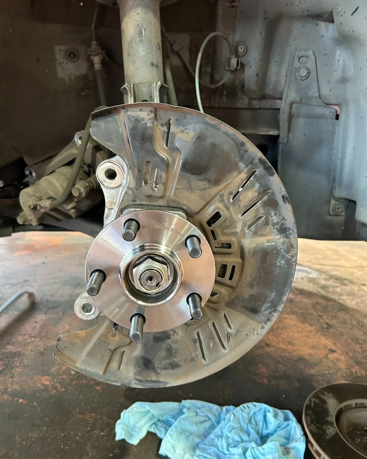 This 2014 Subaru came into the DTE Mechanics workshop for a full service, including checking and fixing the air conditioning, and replacing the driver's front wheel bearing. 

We had to use the hydraulic press to remove this wheel bearing as the driv