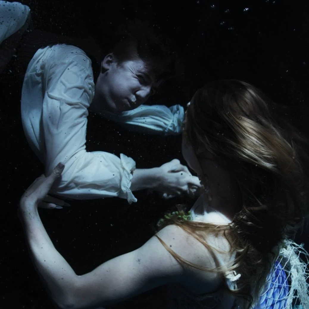 Underwater studio tank cinematography showing two performers in dynamic movement, Oil and Water, Bus Stop Films, RED Raptor S35