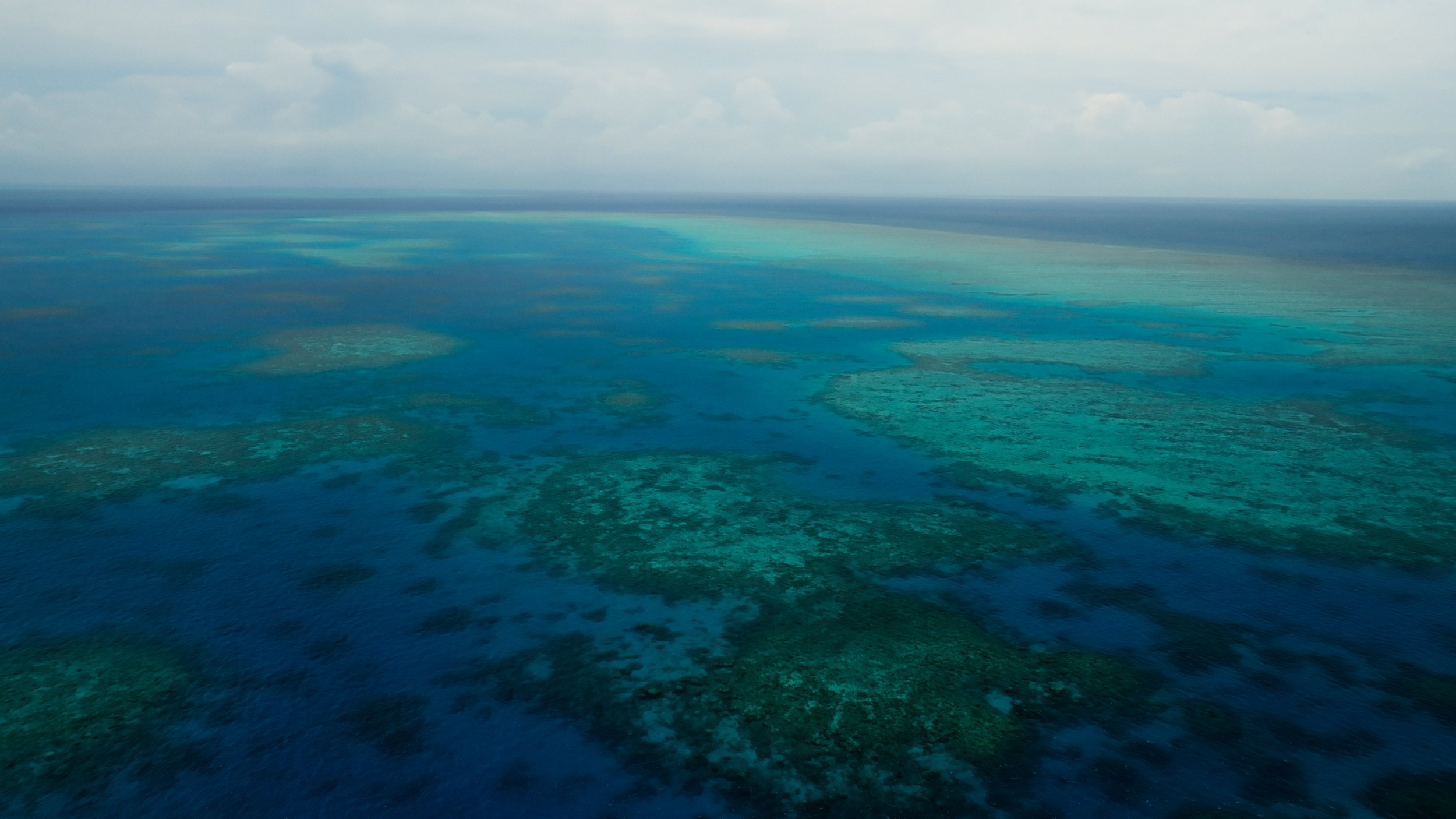 Aerial drone footage of the Great Barrier Reef, Australia, filmed by Woody Spark