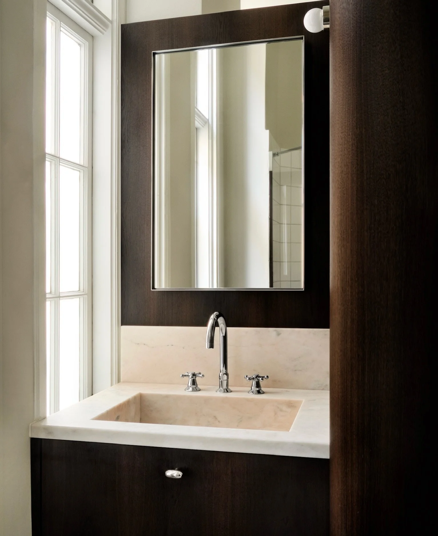 We have a thing for dark wood, especially this custom bathroom we designed for a local client here in Copenhagen. 

Semplice design in smoked oak with @spaces_within knobs and a pink marble sink sourced by our skilled stone partners @stonelab.se 

#b