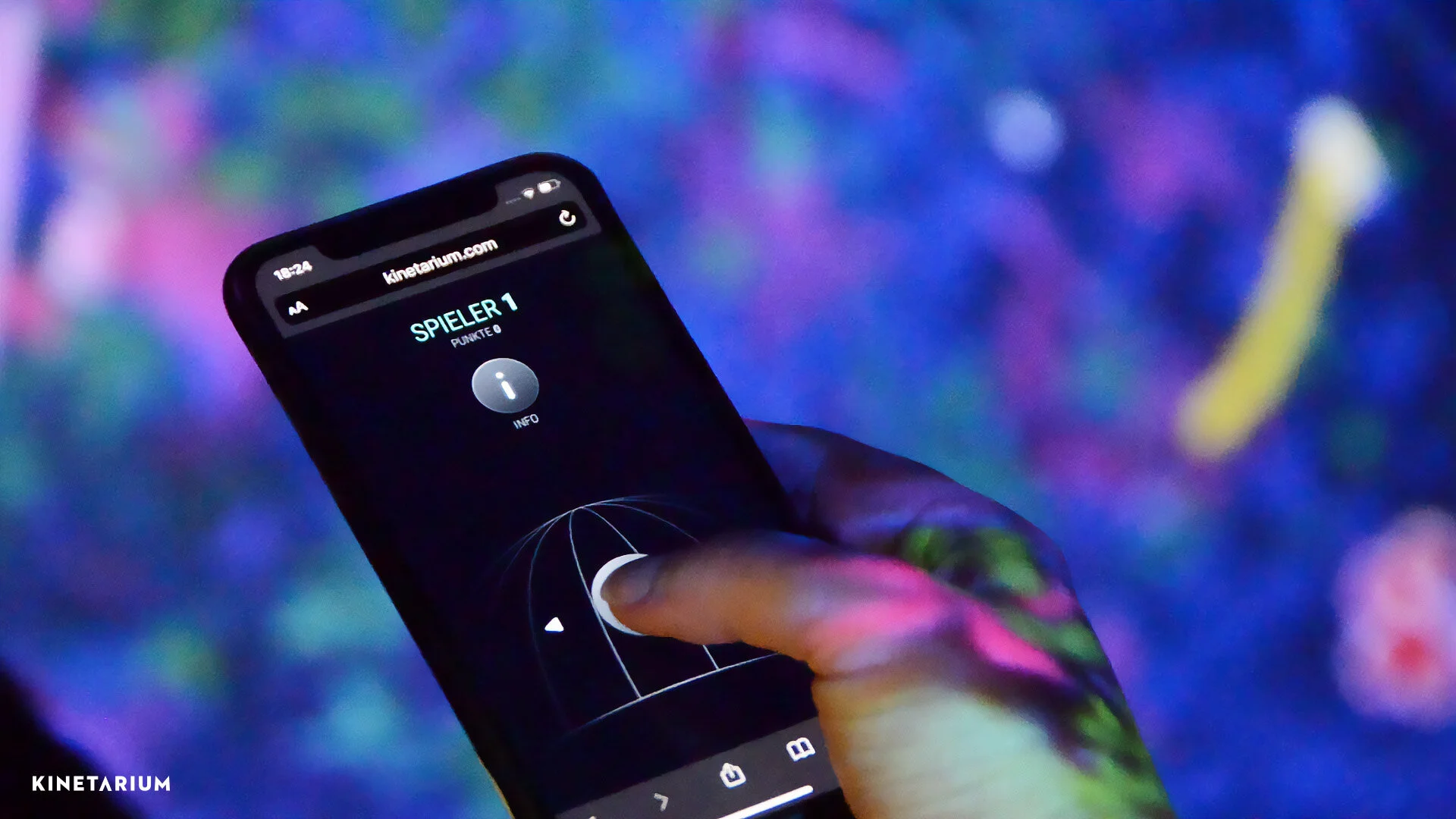 Hand controlling Cineplay game on large screen using smartphone as controller