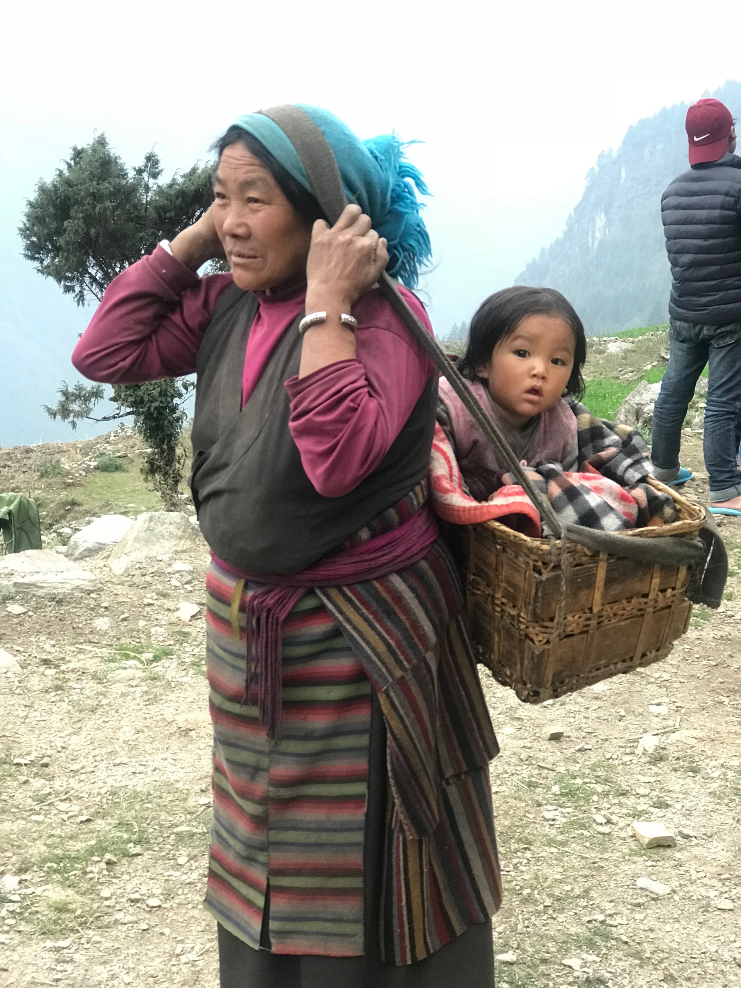 4 Grandmother carrying her granddaughter in Chamtyang between Section 1 & 2.jpg