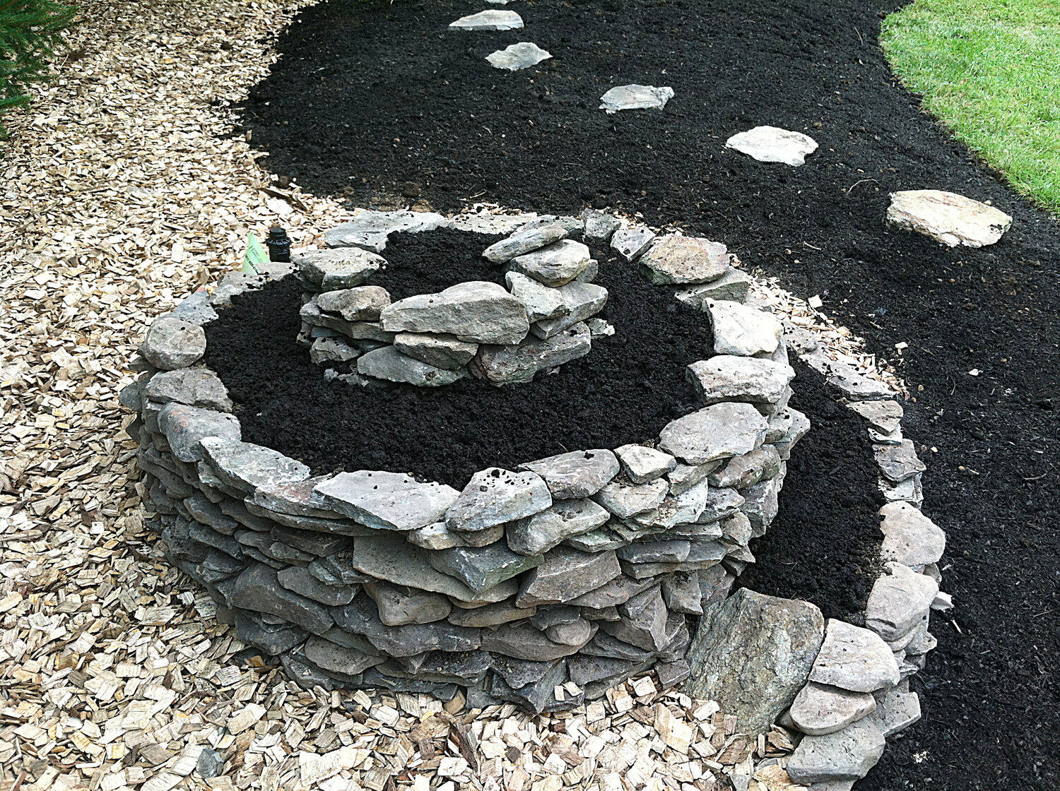Small spiral anchors the larger garden bed or border