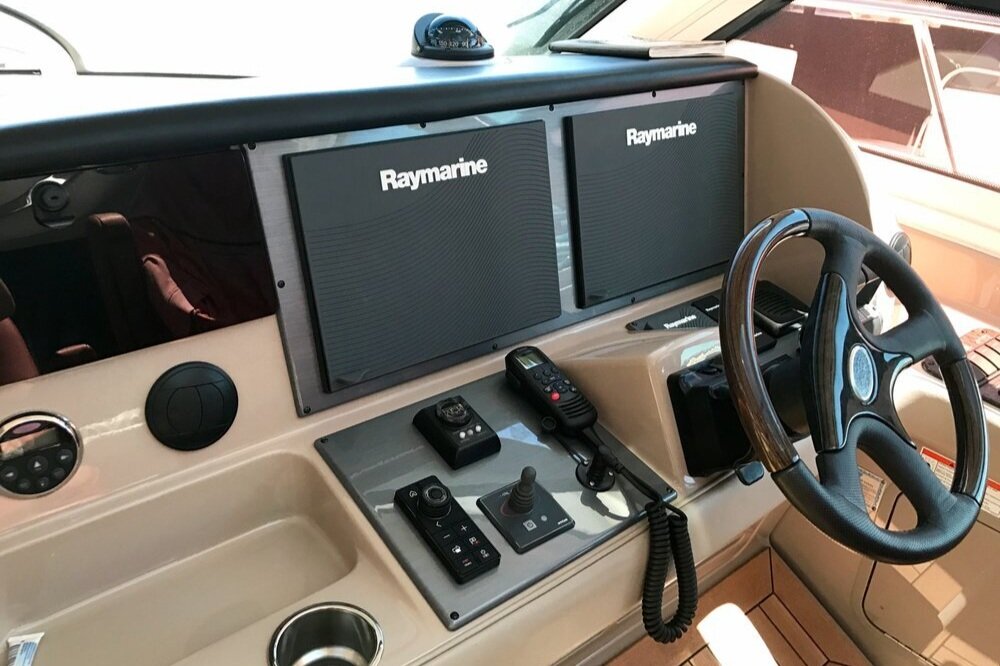 Custom Raymarine displays installed at helm for marine navigation system integration