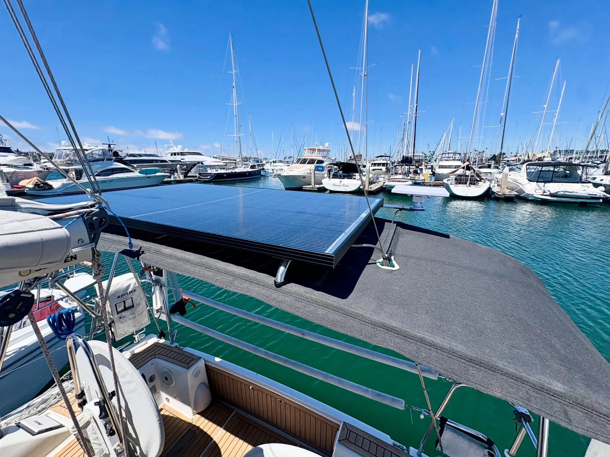 How do you add meaningful solar capacity to a 31-foot sailboat without installing a bulky solar arch?

For this recent project, we designed a custom bimini-mounted solar solution that allowed us to install a 300W solar panel while maintaining a clean