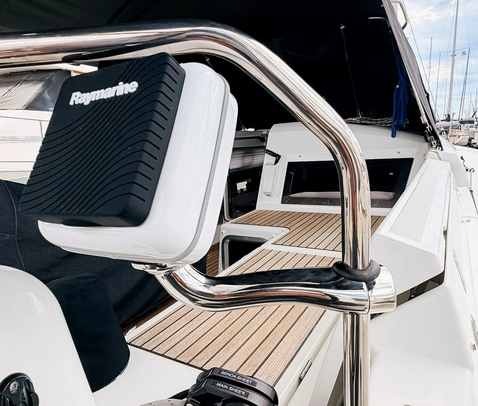 Close-up of a Raymarine i70s sailing instrument mounted on a NavPod rail mount aboard a Jeanneau 440 sailboat.