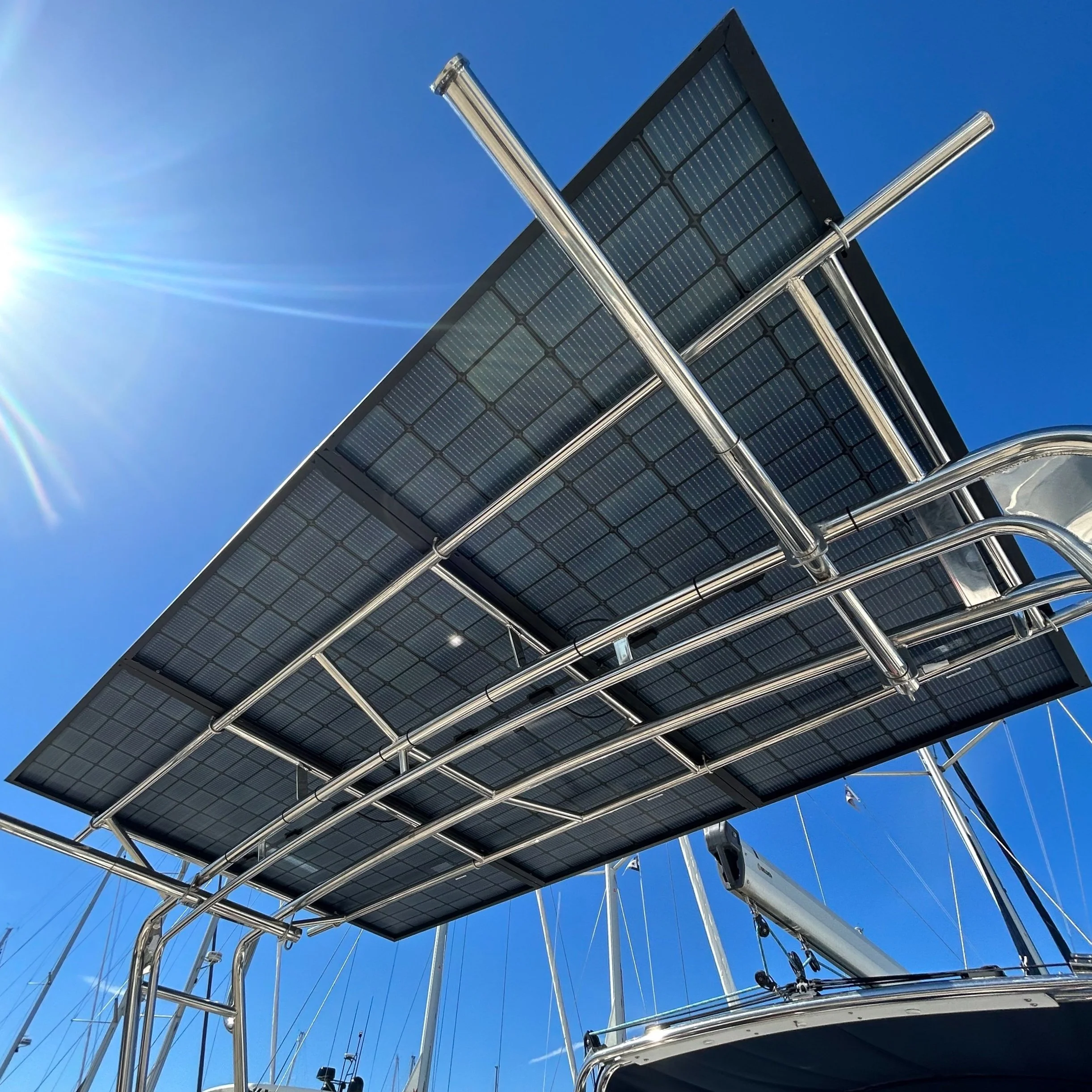 Solar panel array mounted on sailboat arch for marine solar power system installation