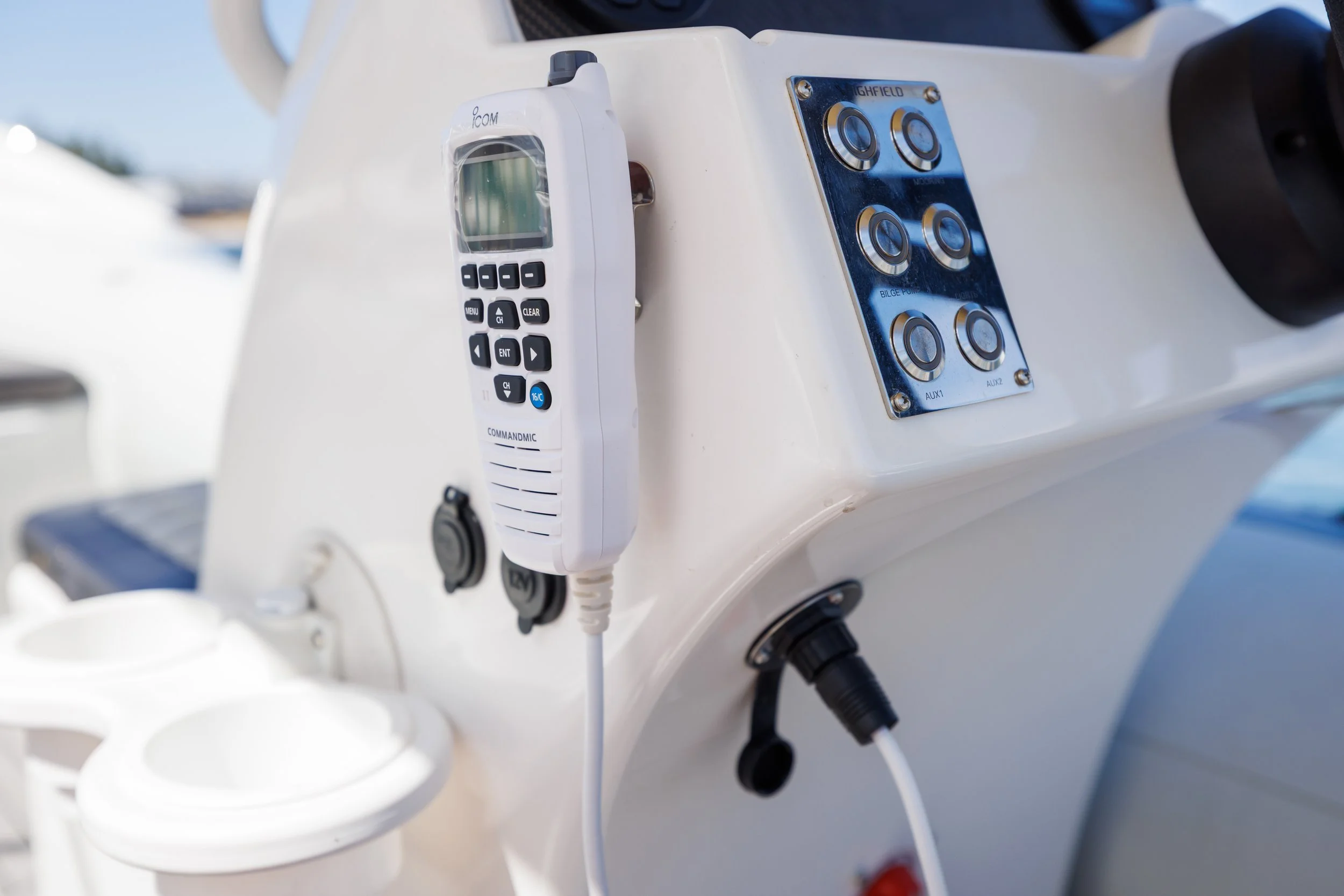 Icom CommandMic VHF radio system installed on a yacht tender for communication and safety.
