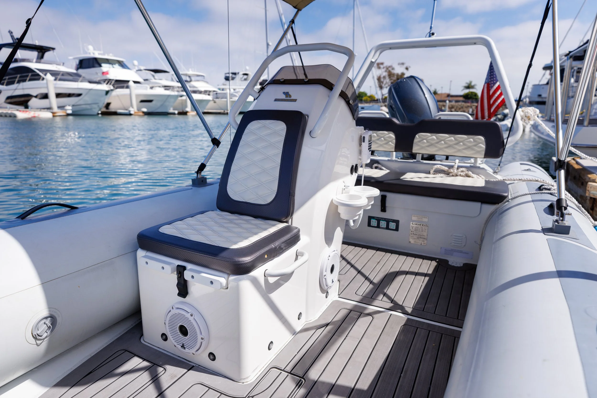 Upgraded yacht tender equipped with marine audio and VHF communication systems.