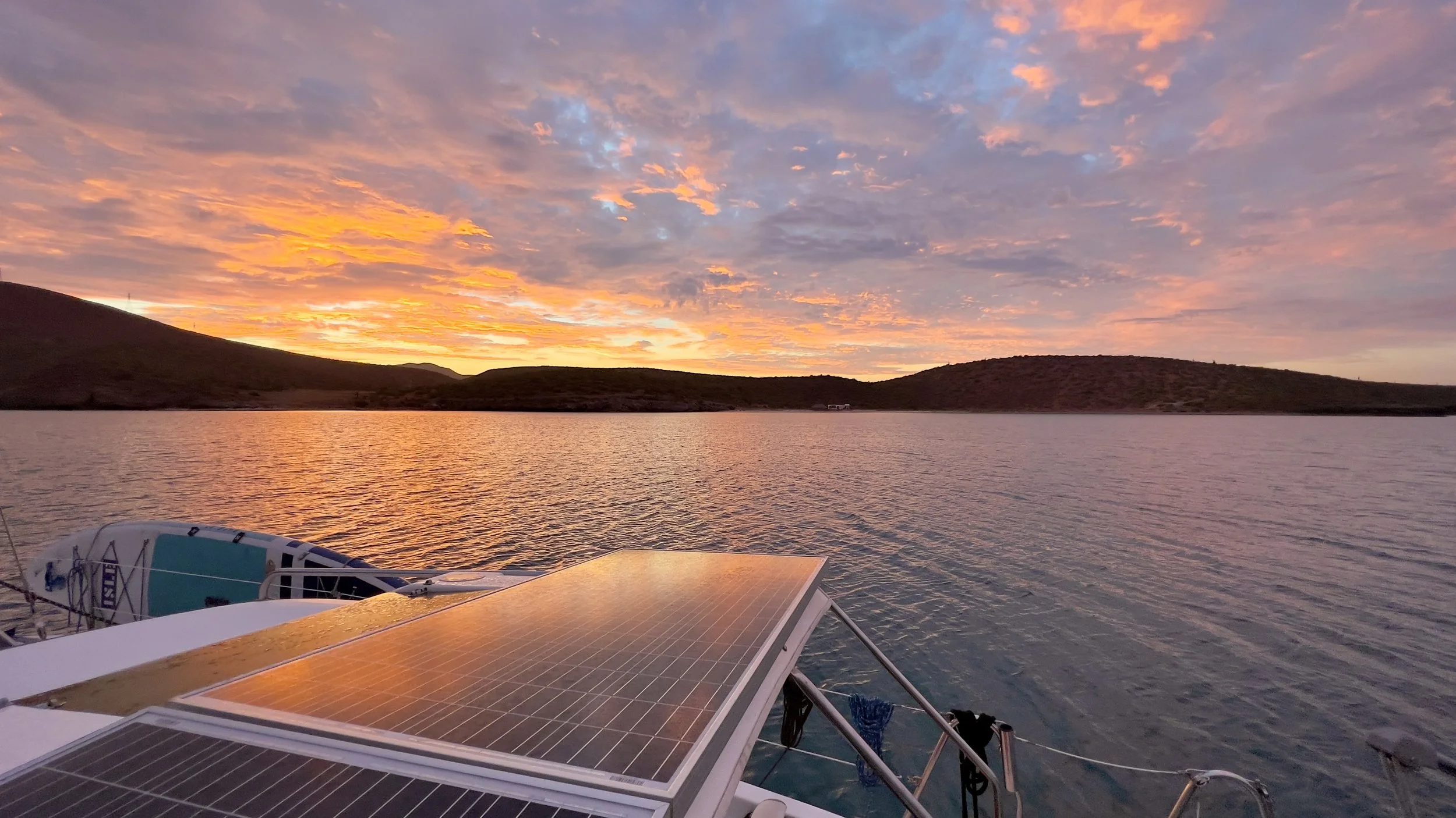 Solar panels providing power on a cruising sailboat