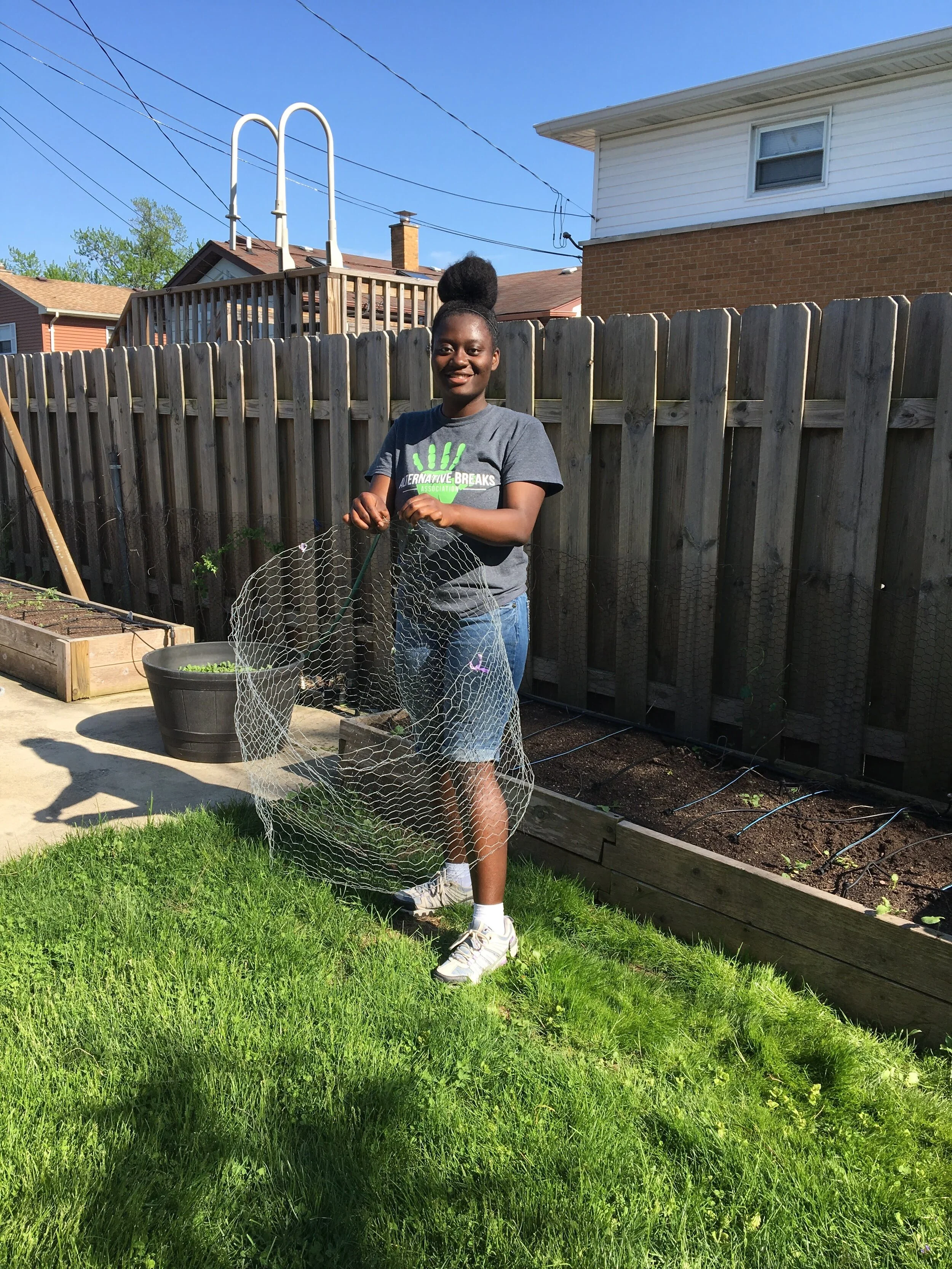 An In the Gardens volunteer packing up equipment for donation.
