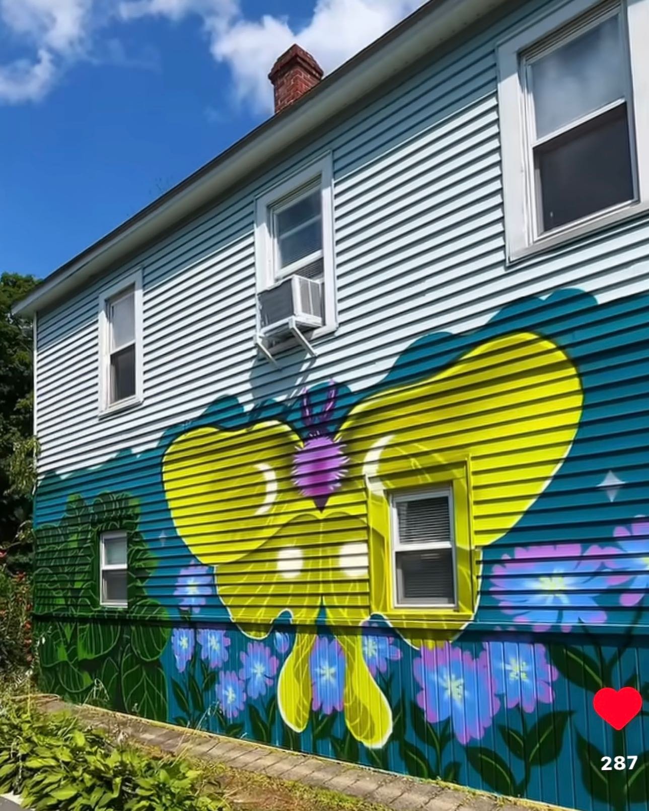 Artist and High Falls native Kat Farrell, whose digital illustrations are influenced by manga and anime, recently branched out into architecture! Kat’s large scale mural, a colorful interpretation of native plants and wild yam leaves, is highly