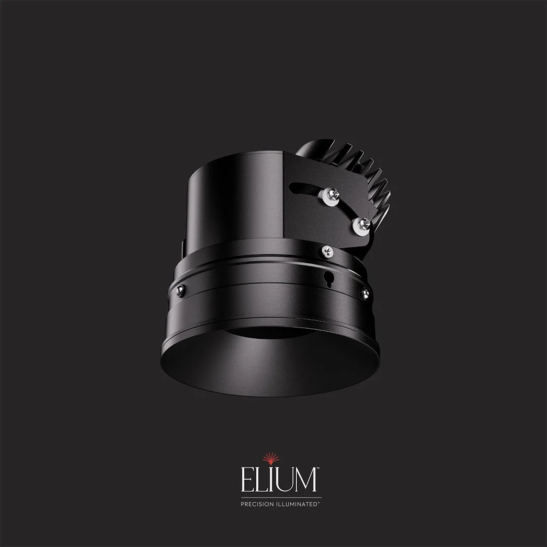 Close-up of a black, cylindrical object with a ridged section on the side, isolated against a black background. The text at the bottom reads 'ELIUM' with the tagline 'PRECISION ILLUMINATED'.