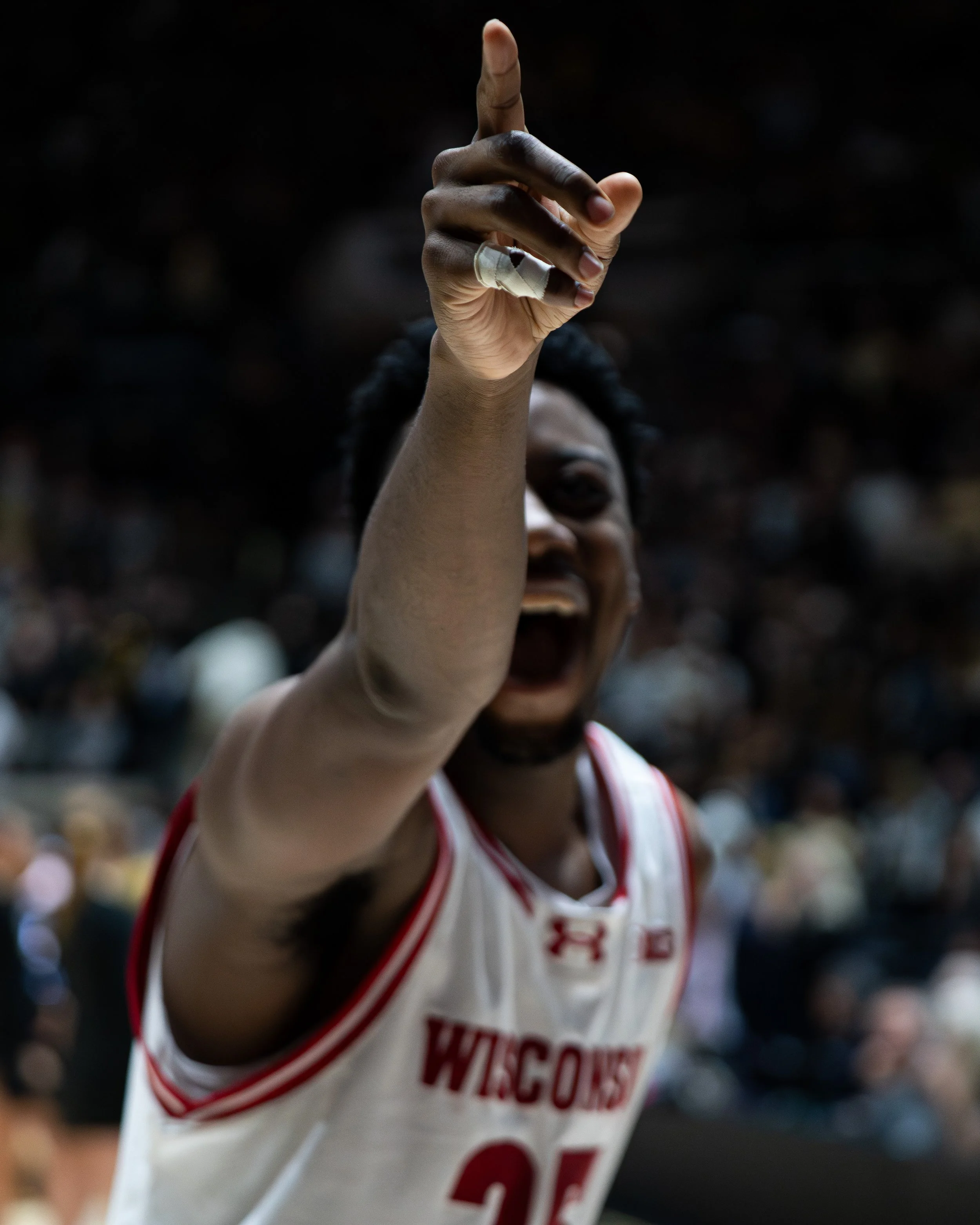  Wisconsin Badgers guard John Blackwell (25) points and laughs at fans after beating the Purdue Boilermakers at Mackey Arena. 