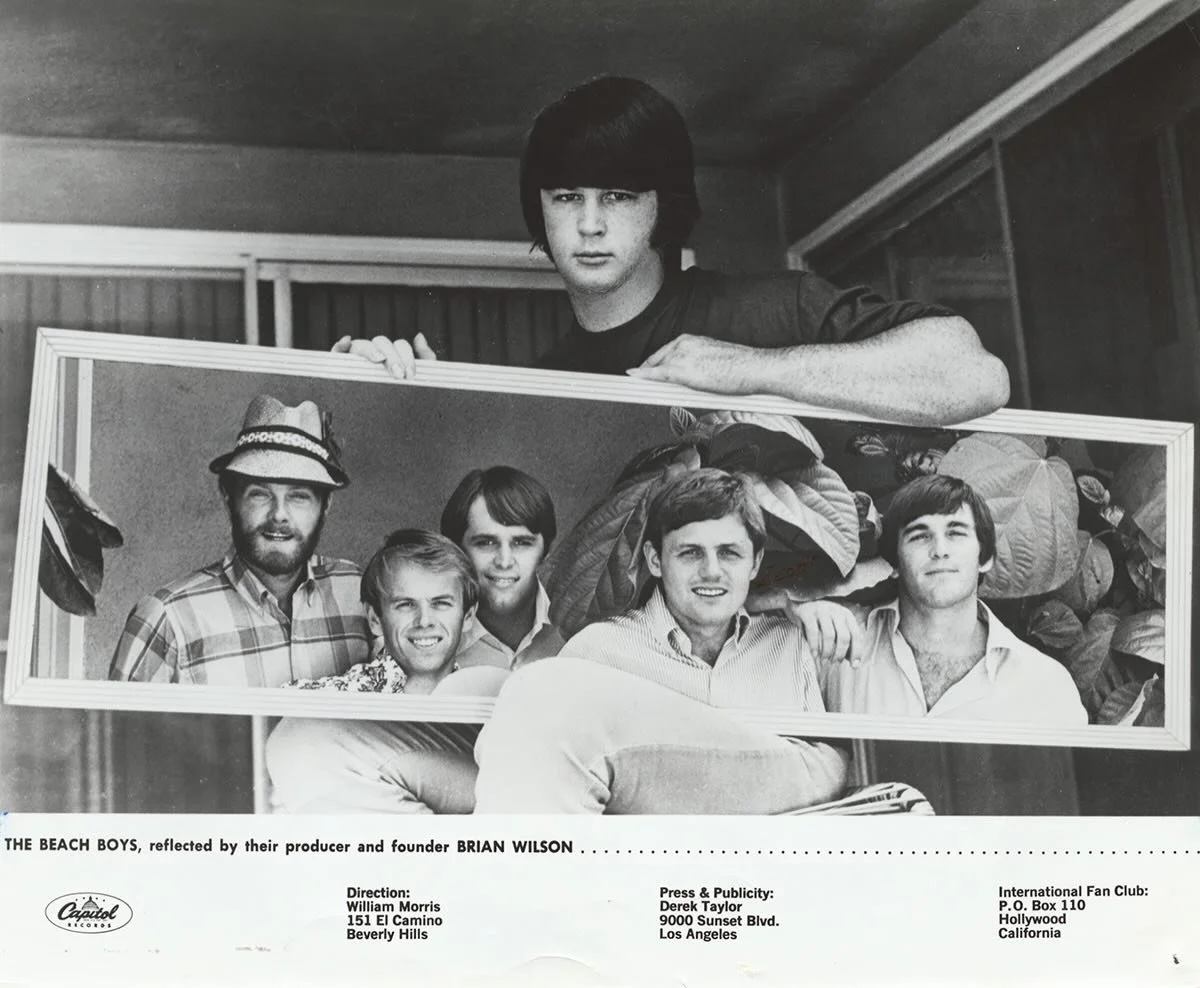 Classic 1966 Beach Boys publicity photo of Brian holding up a mirror to the &lsquo;Boys.