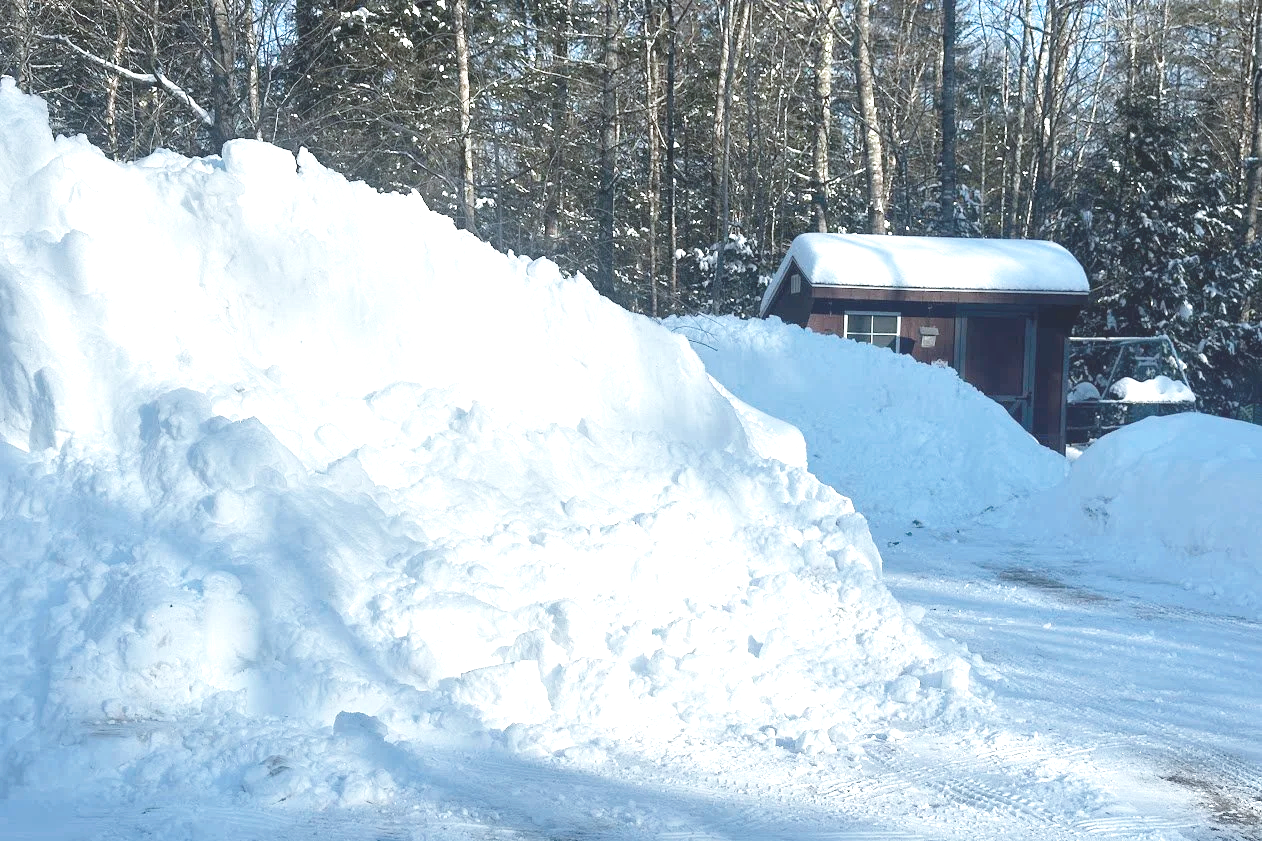 Snow piled up around chicken coop