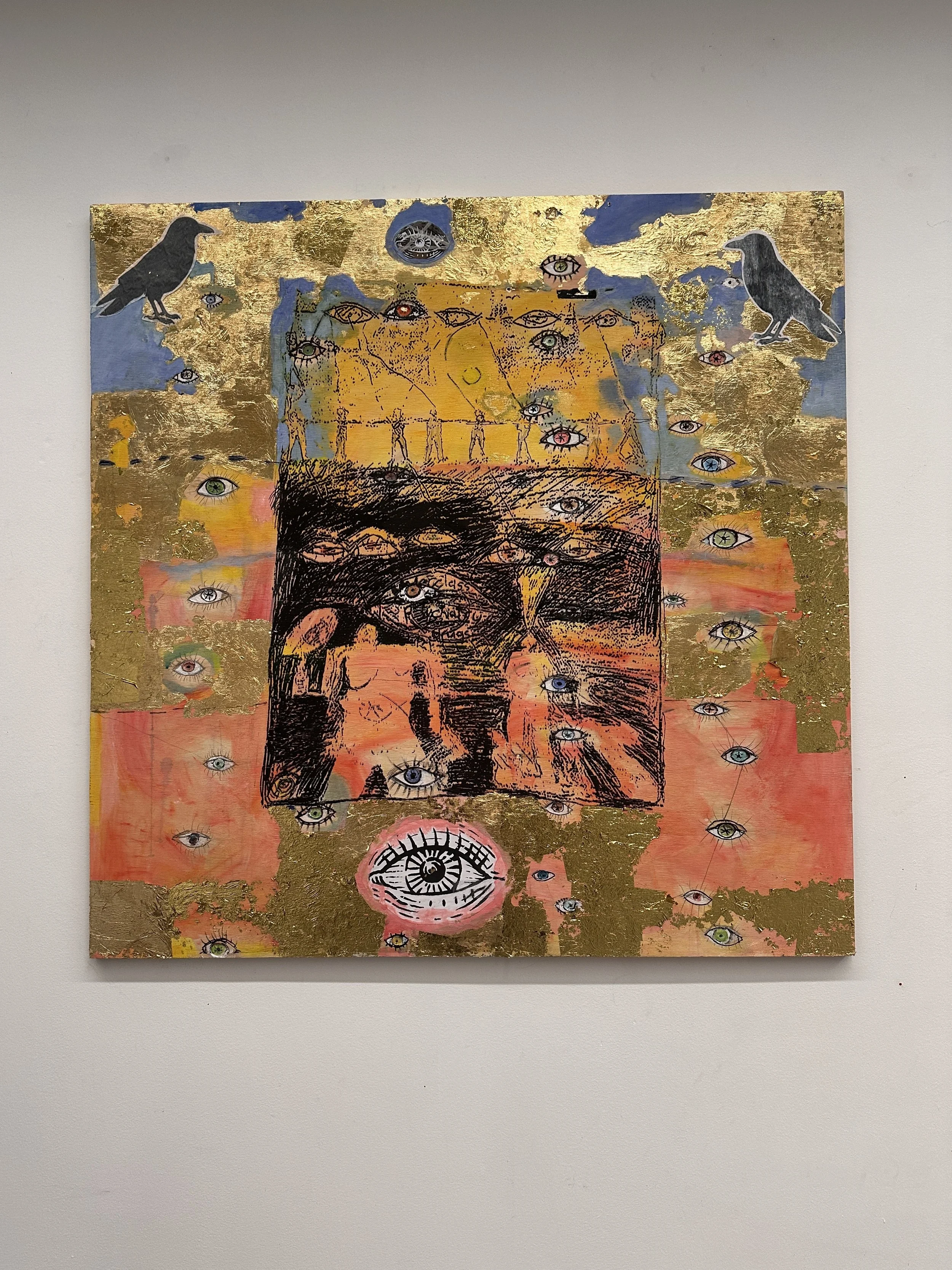 Hillary Monckton, I am Surveilled, 2026. Multimedia artwork on a large square canvas in gold, black, blue, yellow and orange. Abstract, scratchy black marks and collaged images depict figures being watched by eyes and crows.