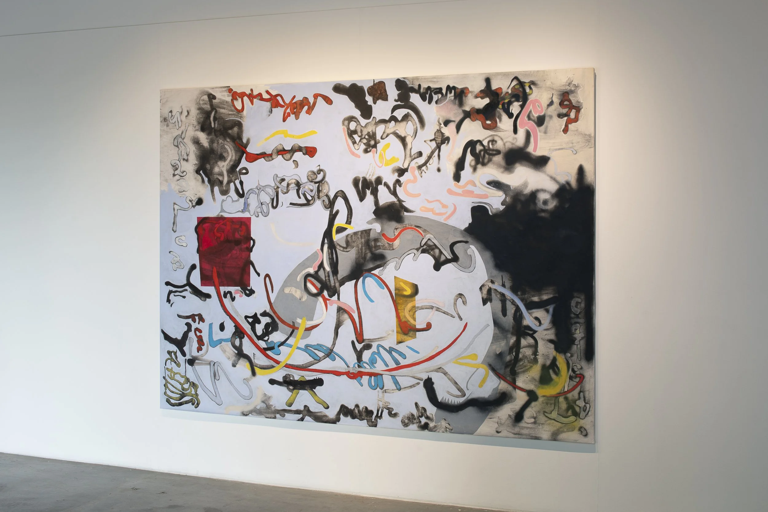 Large abstract paiting. Squiggles and lines that resemble spray paint in red, blue, yellow, pink and black on a light blue background.