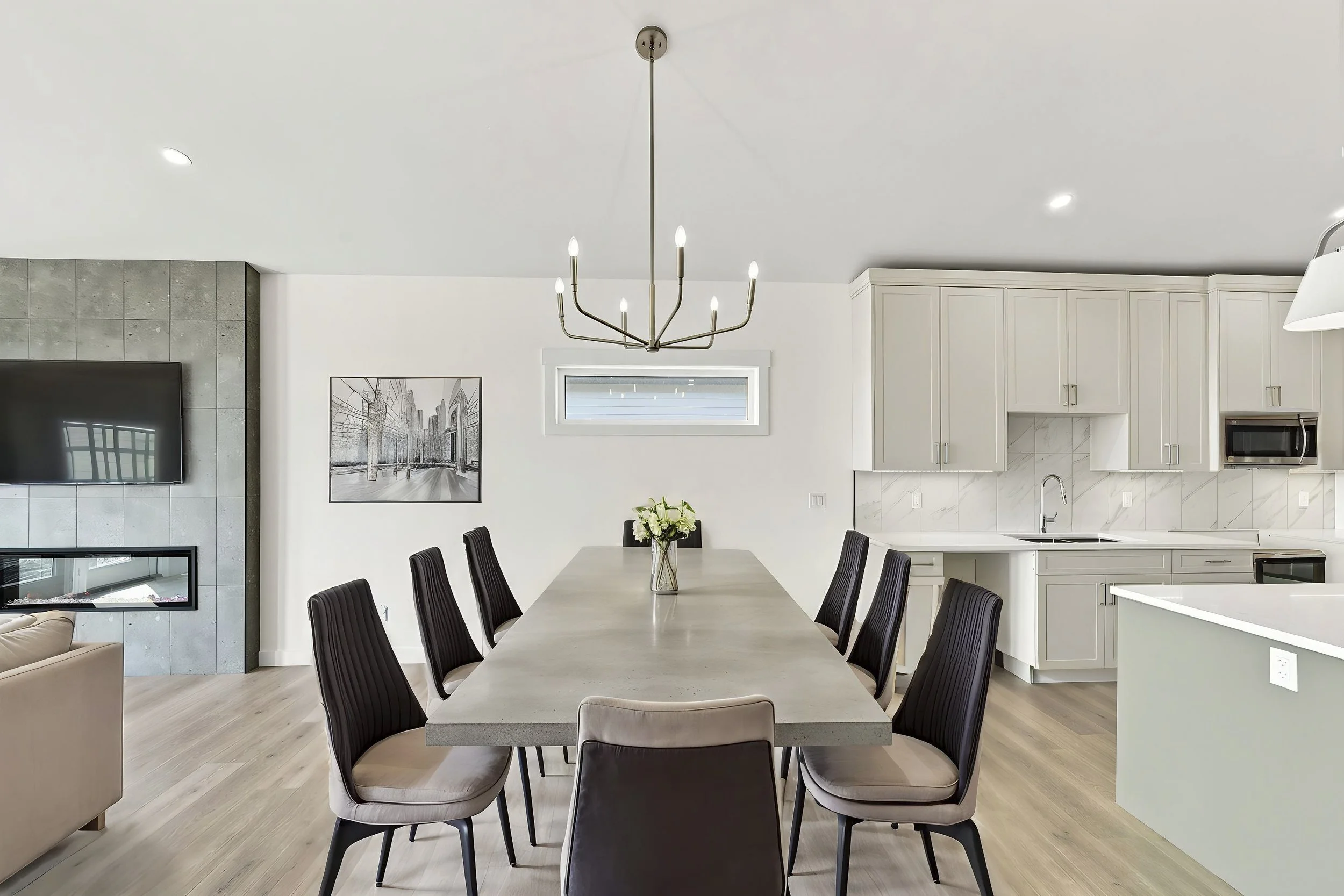 Virtually staged dining room with modern table, chairs and wall art