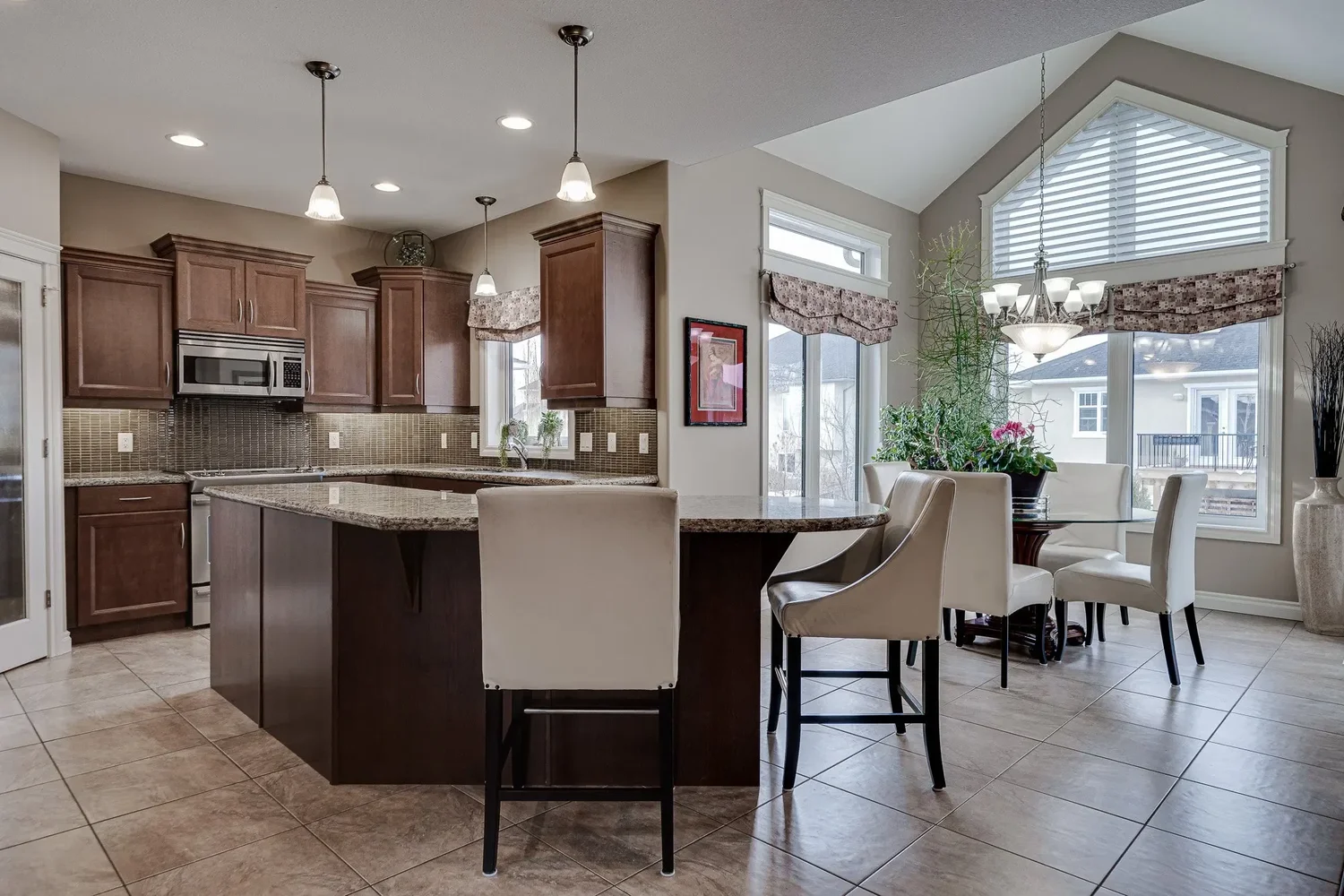 Bright open-concept kitchen and dining area with clear surfaces
