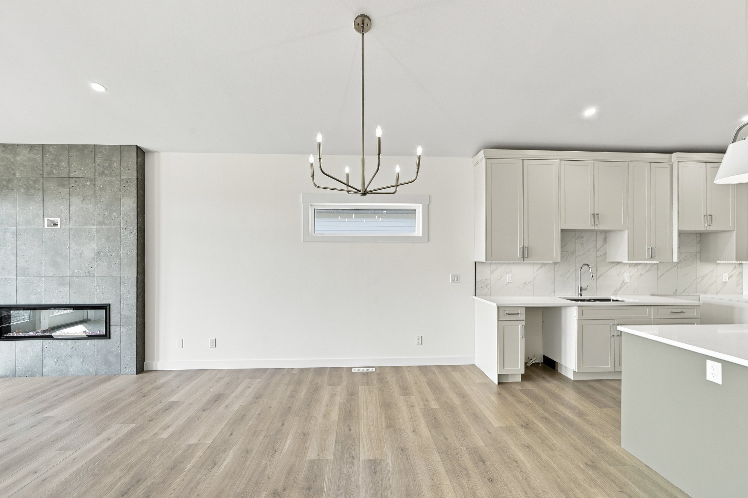 Empty dining area before virtual staging in a modern open-concept home