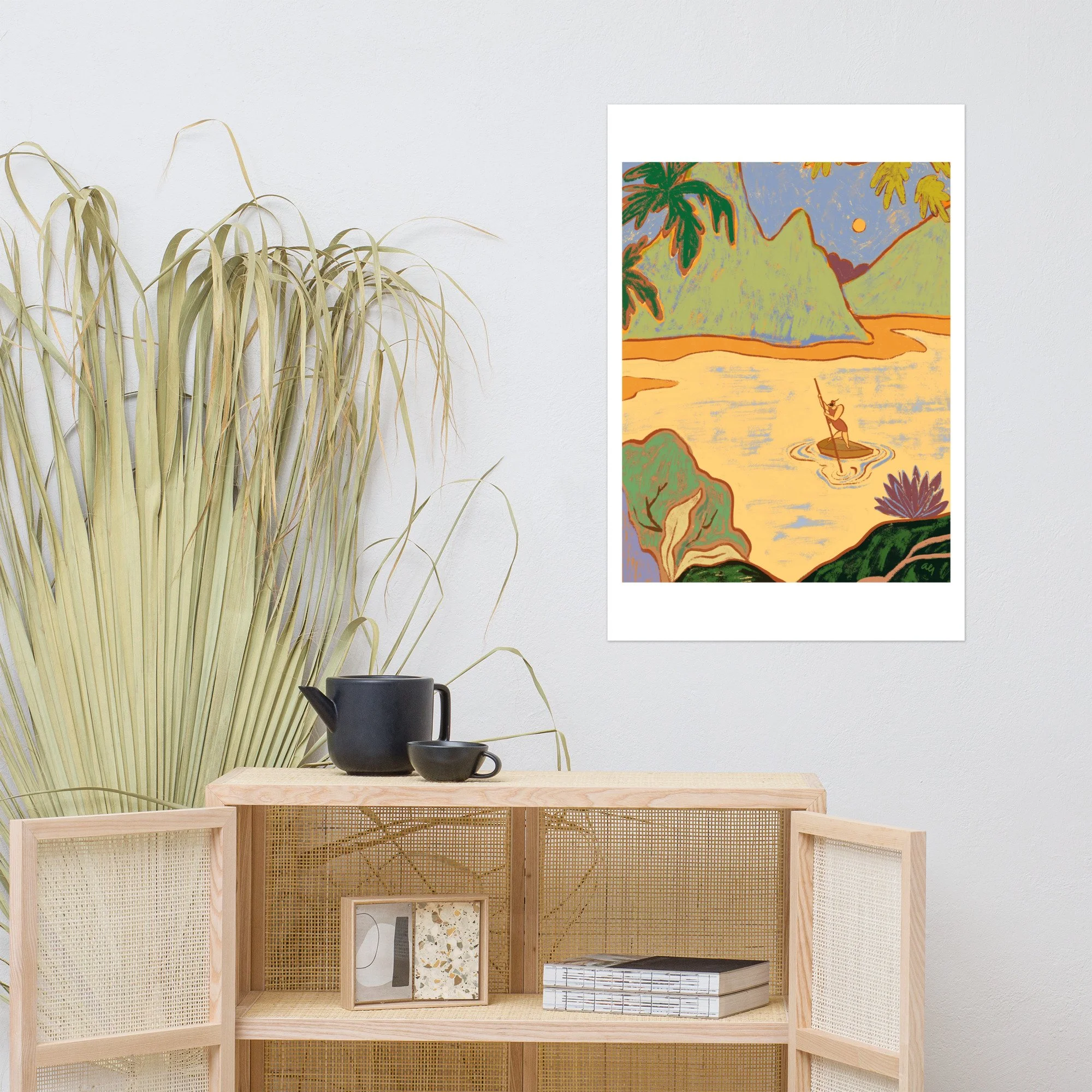 Lone woman rowing a boat through a tropical waterway.