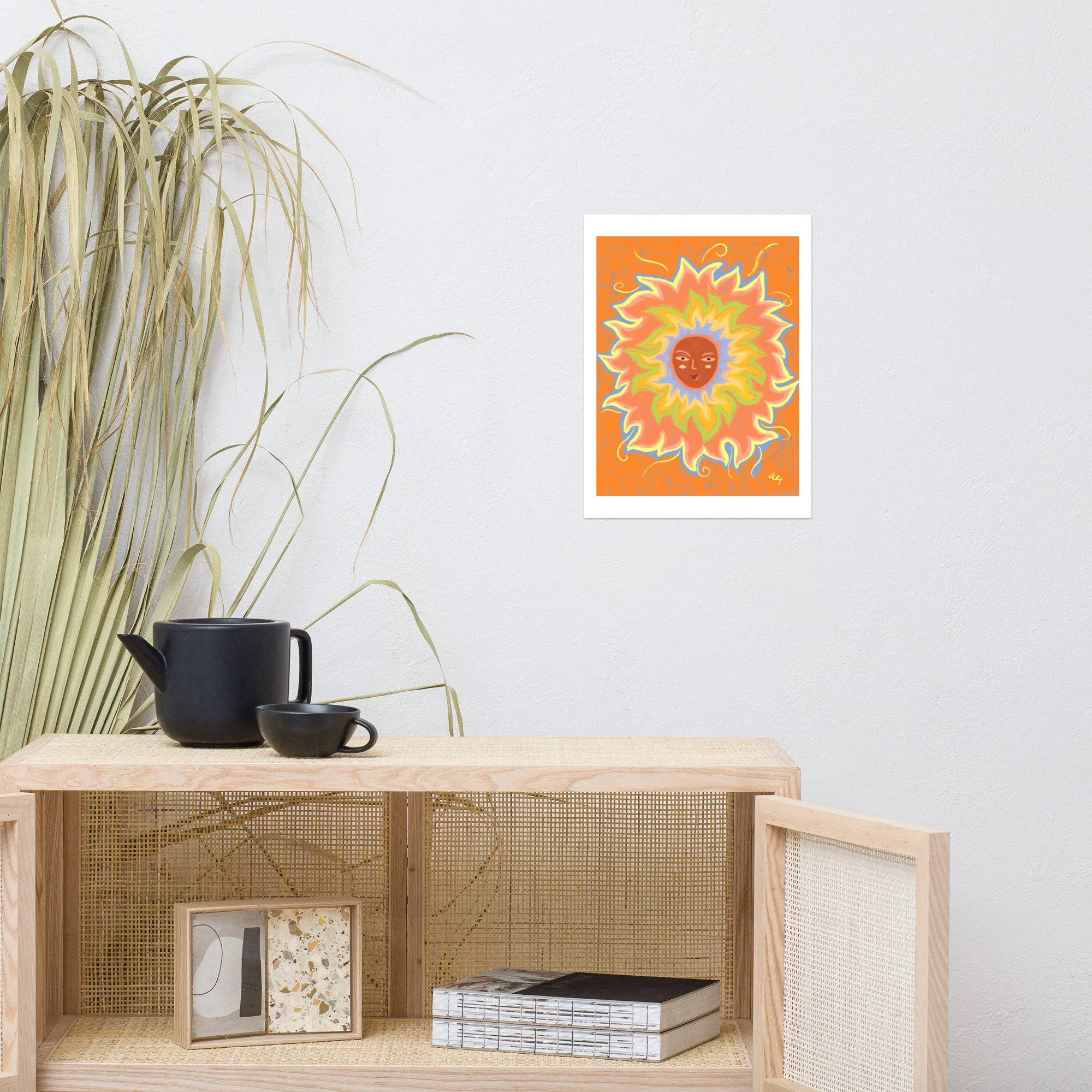 Illustrated sun with a woman's face and rainbow rays.