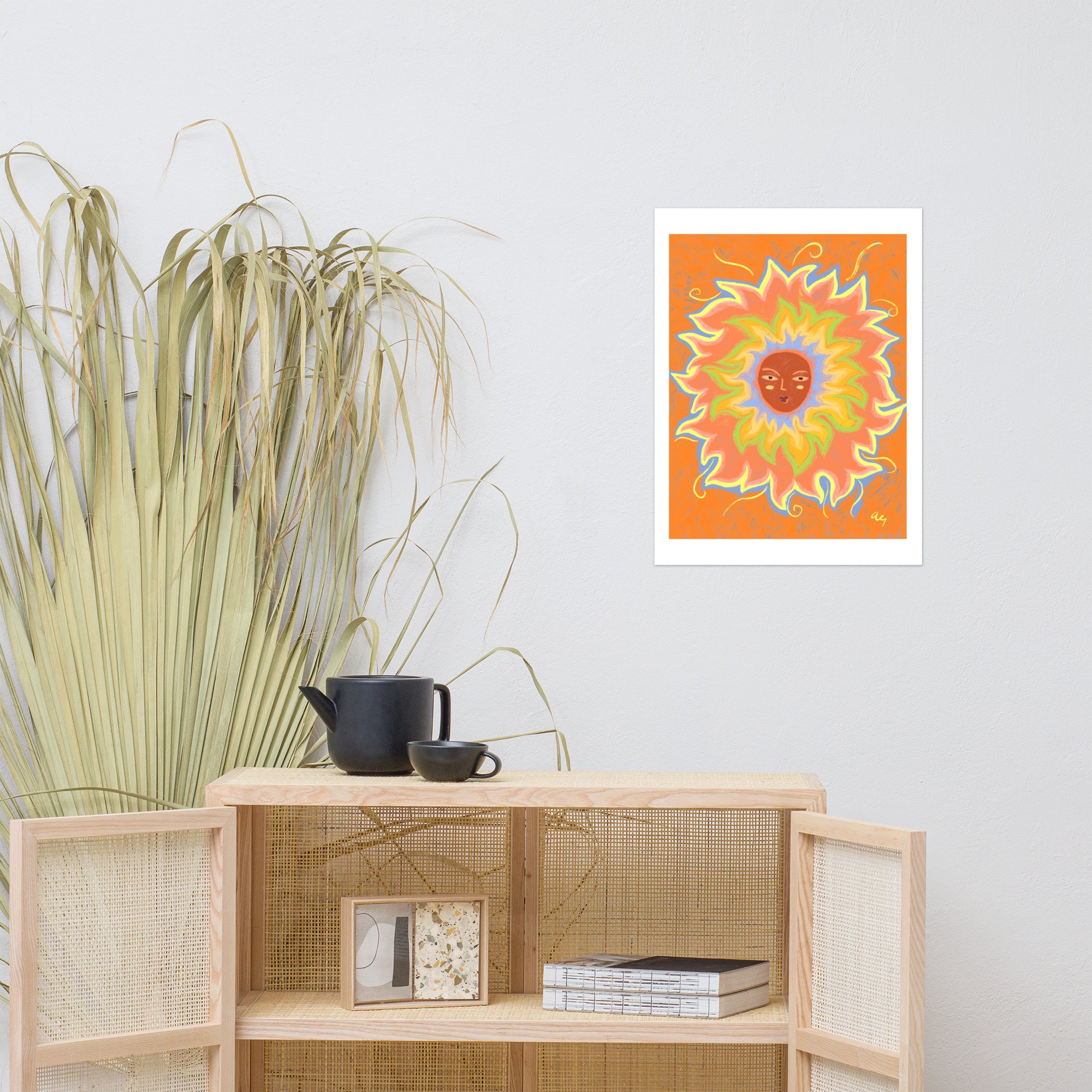 Illustrated sun with a woman's face and rainbow rays.