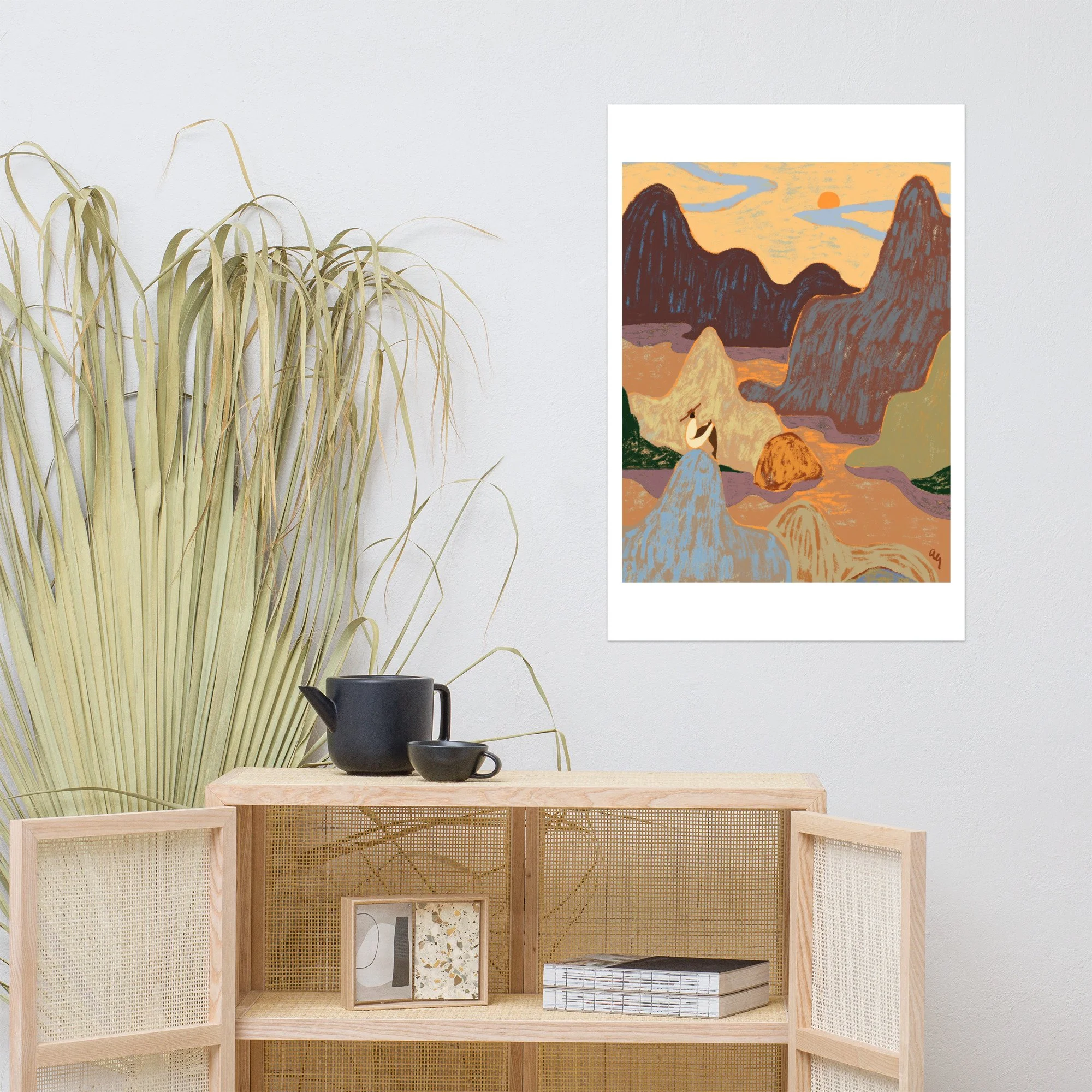 Woman sitting atop a mountain gazing up at the sky.