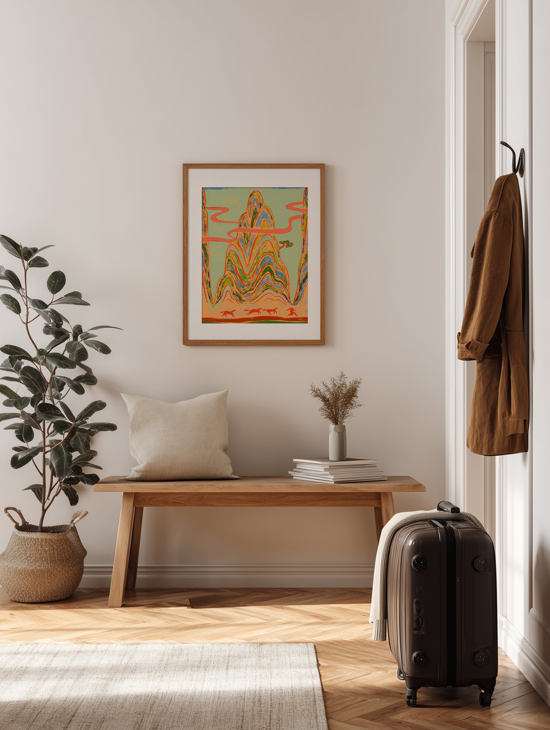 Woman running ahead of wild horses with towering mountains behind.