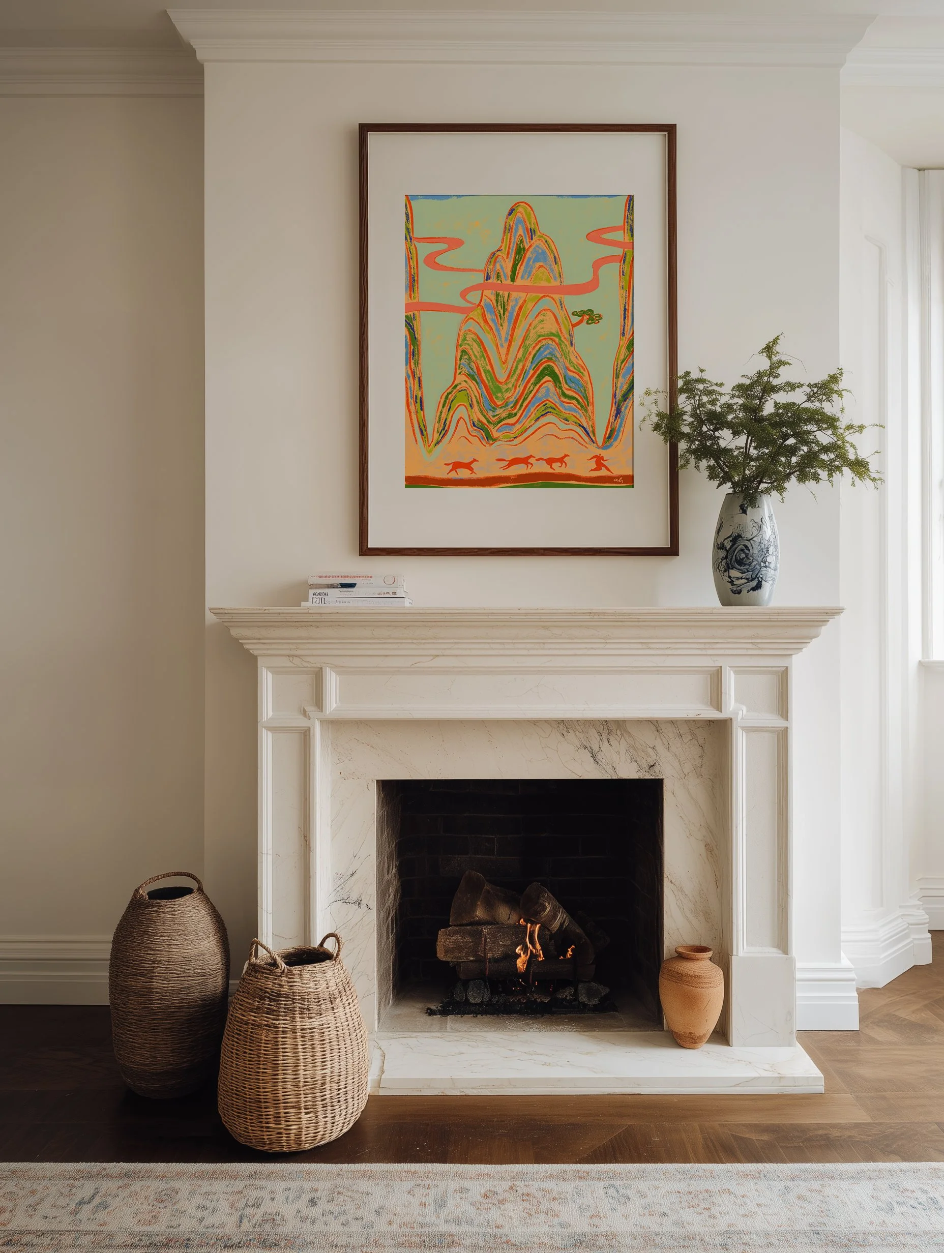 Woman running ahead of wild horses with towering mountains behind.