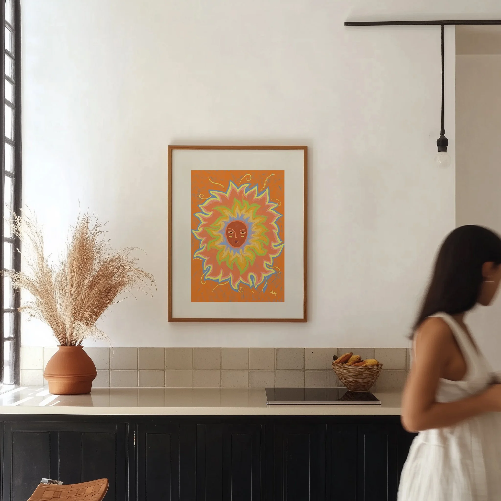 Illustrated sun with a woman's face and rainbow rays.
