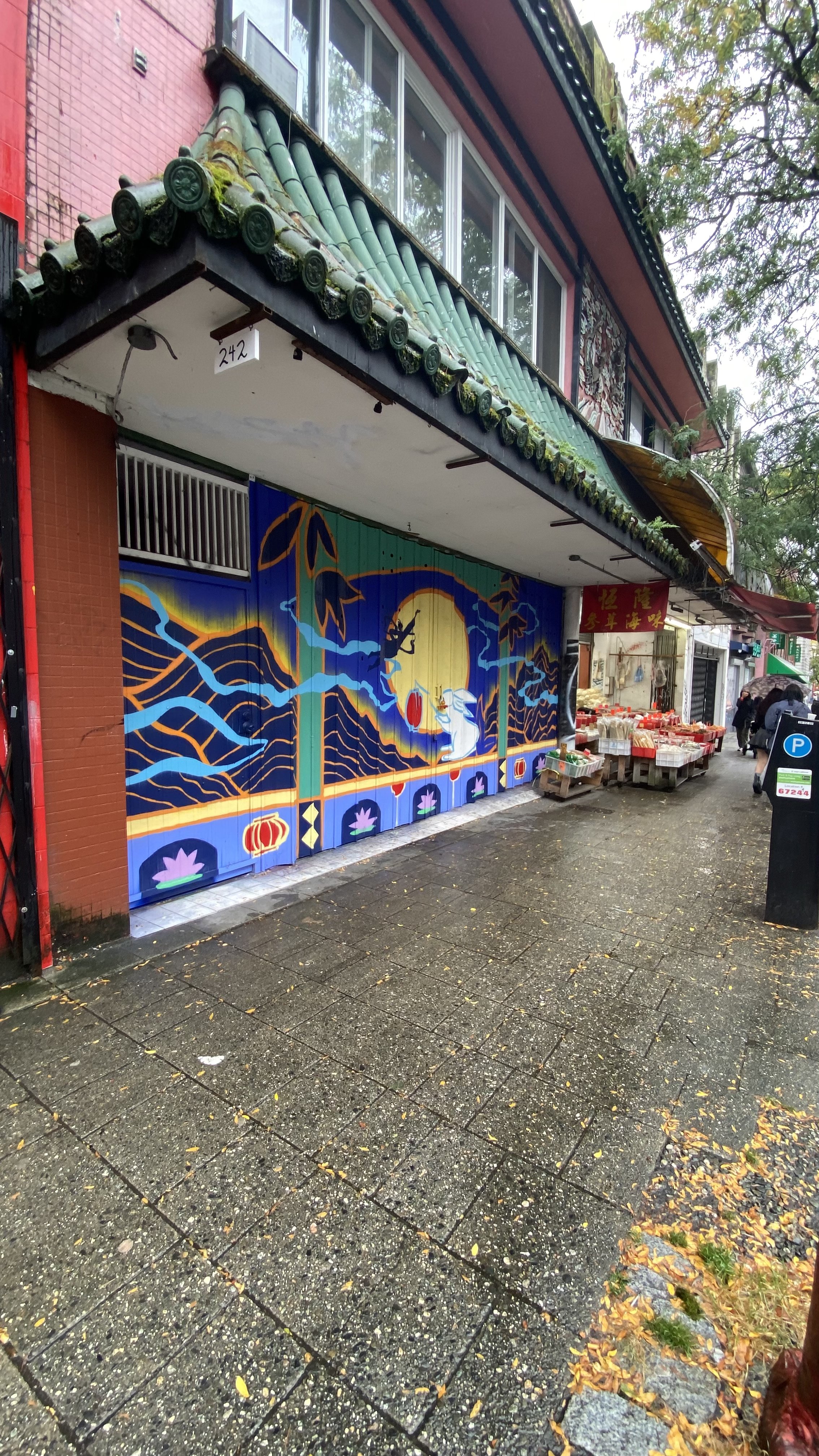 Arty Guava Chinatown mural inspired by the Mid-Autumn Festival, featuring vibrant colours, flowing figures, and symbolic elements celebrating reunion, moonlight, and cultural heritage.