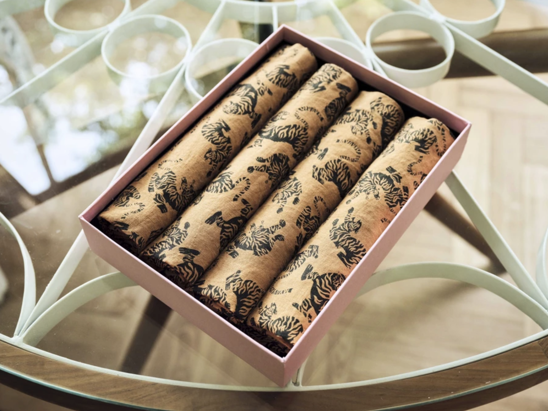 Arty Guava’s nature-inspired art adorns Ong Shunmugam’s luxury homeware collection, including napkins, placemats, and throw blankets.