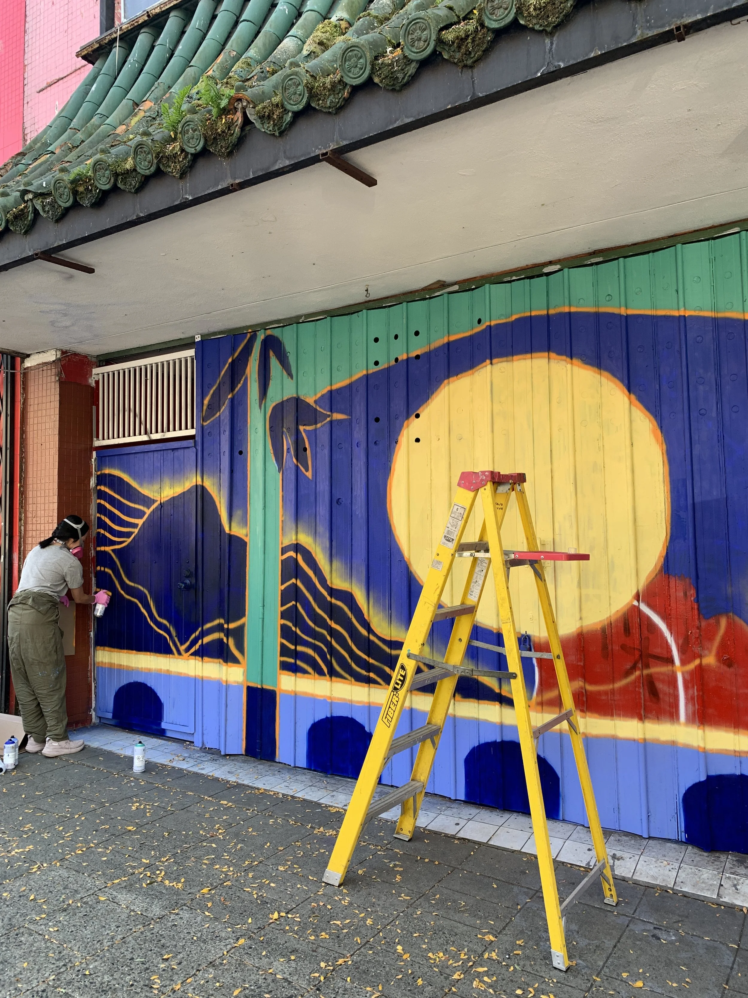 Arty Guava Chinatown mural inspired by the Mid-Autumn Festival, featuring vibrant colours, flowing figures, and symbolic elements celebrating reunion, moonlight, and cultural heritage.